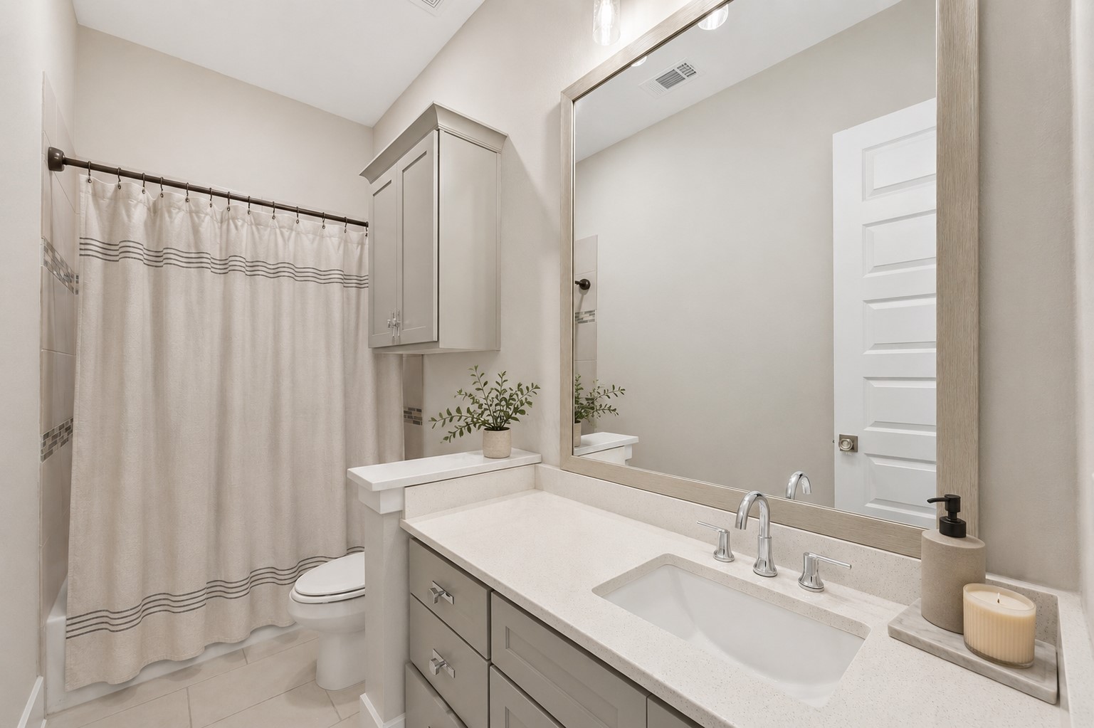 First-floor en-suite bathroom serving the guest bedroom with contemporary finishes and private access.