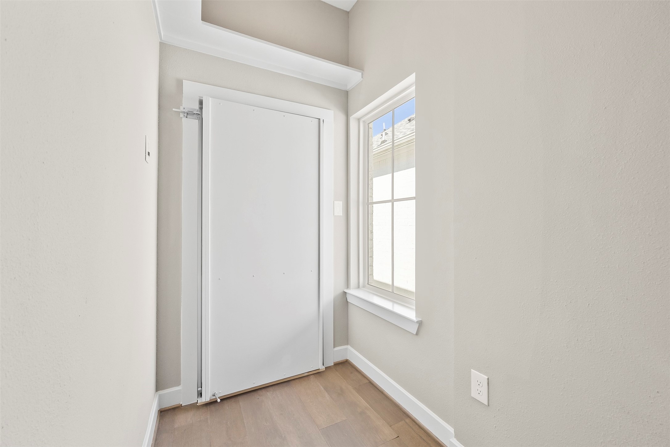 Hidden storage room providing additional organized storage space rarely found in similar homes.