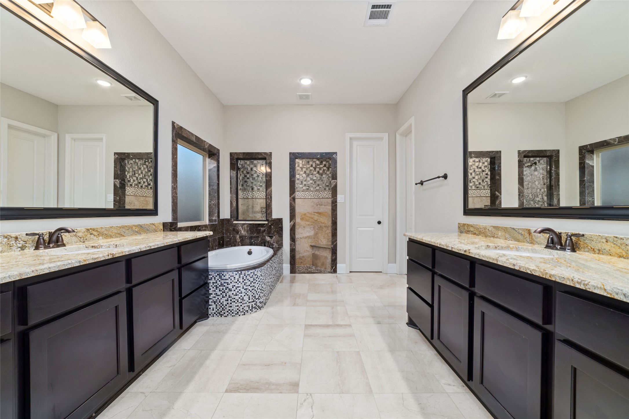 primary bathroom with double vanities