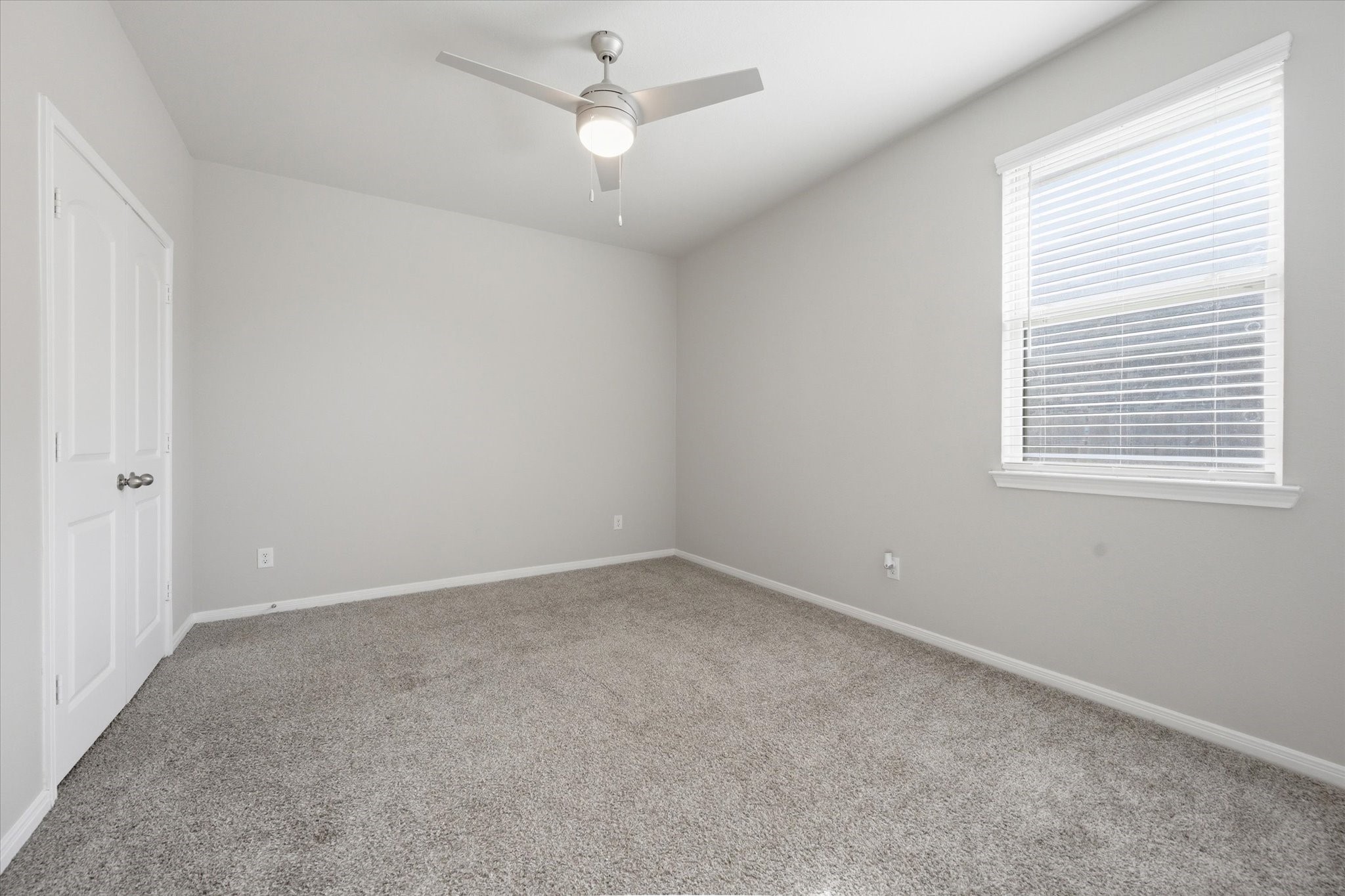 This inviting home features a spacious backyard perfect for relaxation and outdoor activities, complementing its cozy interior.