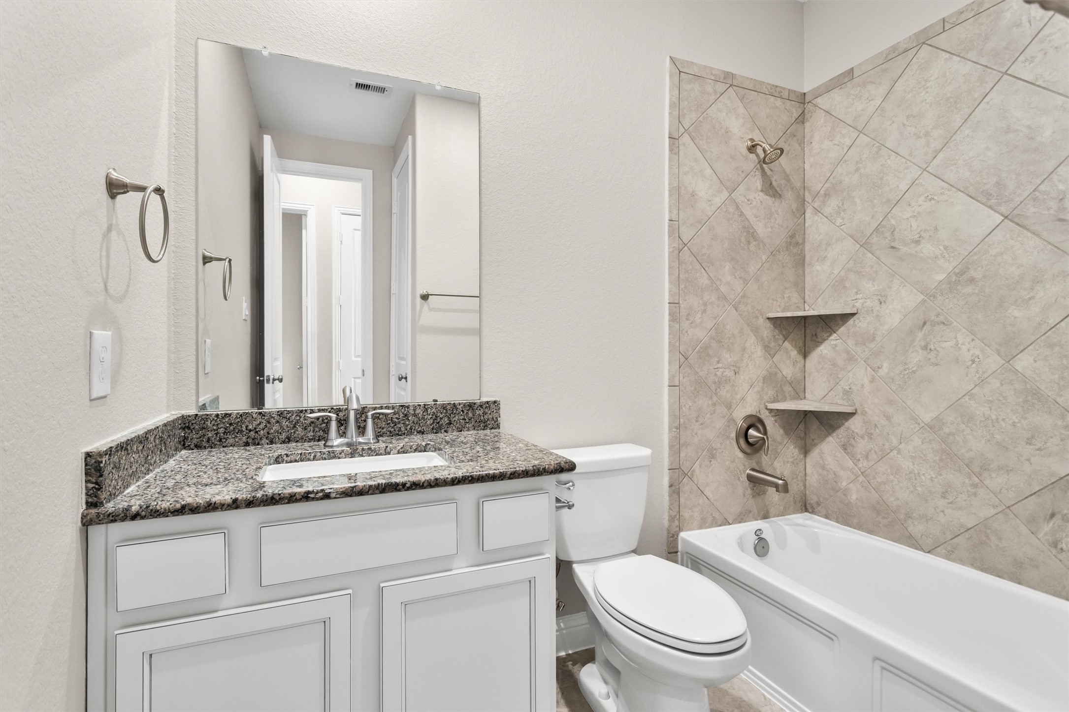 Hall bathroom with combined tub/shower