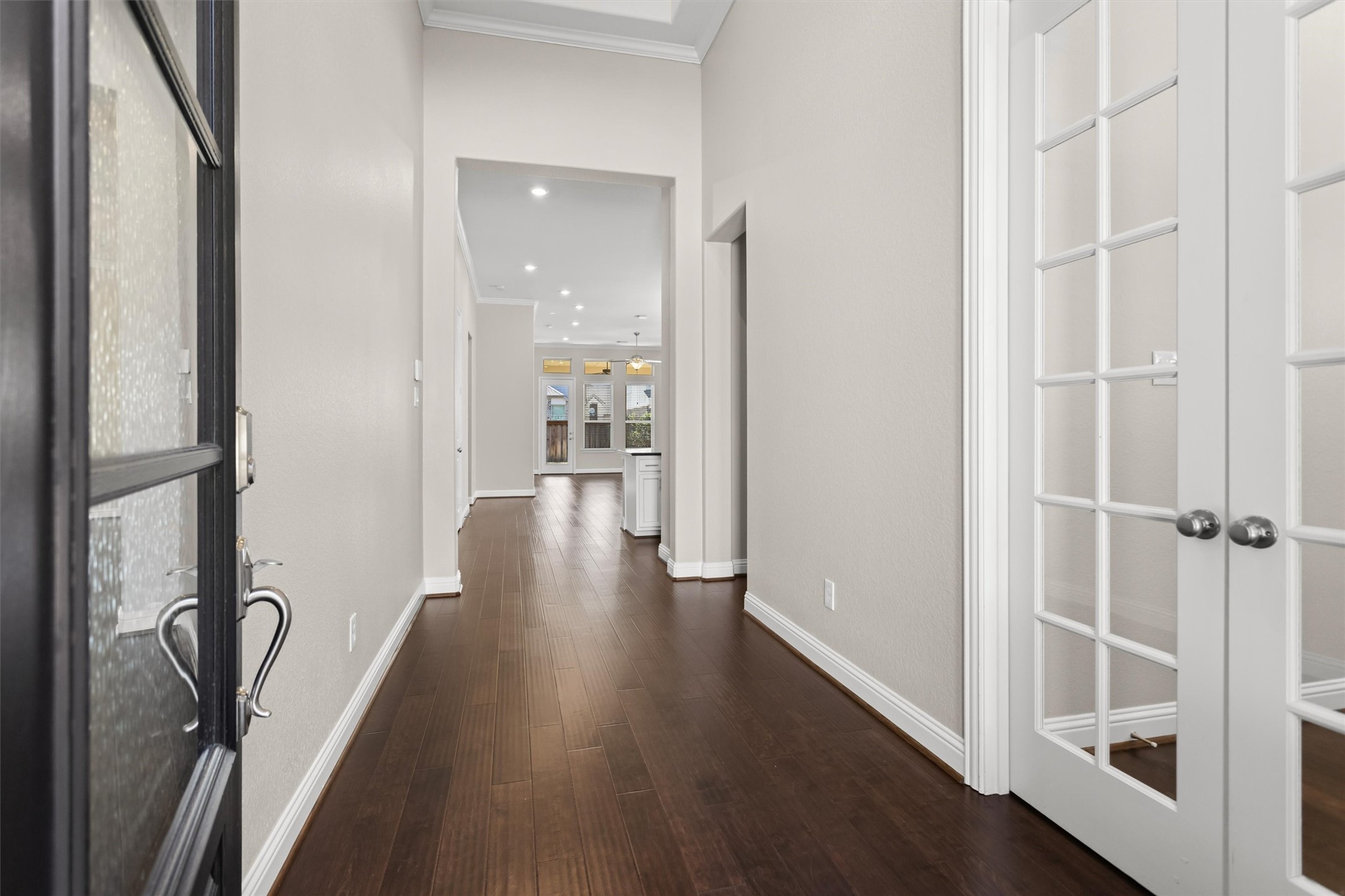 Wide hallway with beautiful wood flooring
