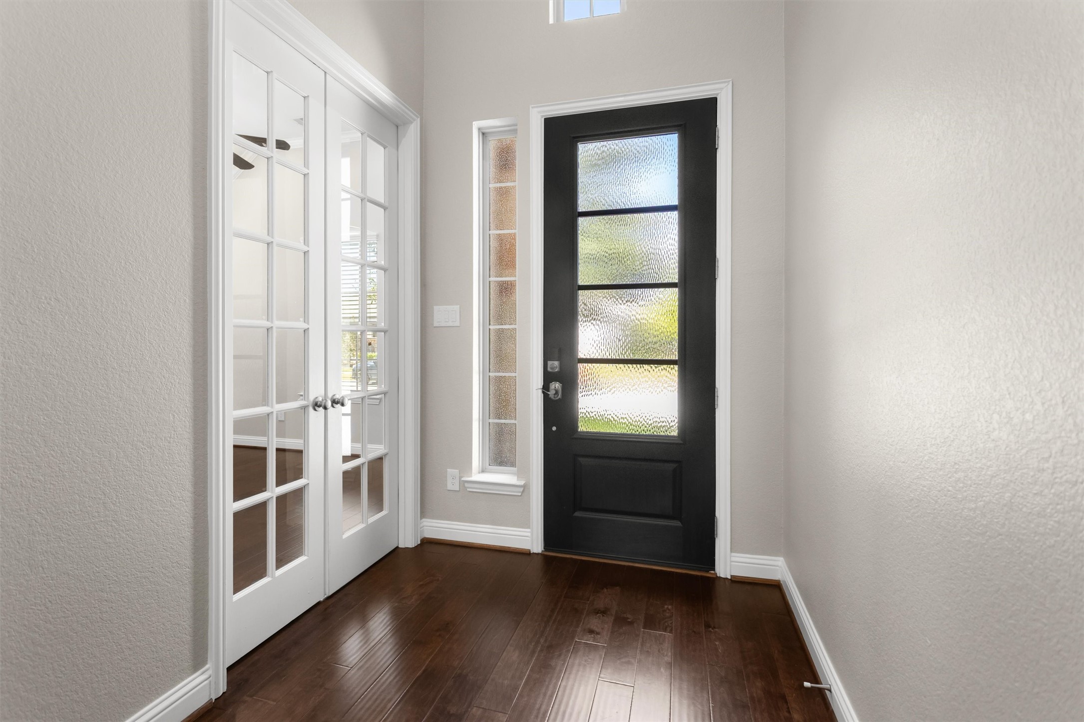 Home office with double French door entry to the right of the entry