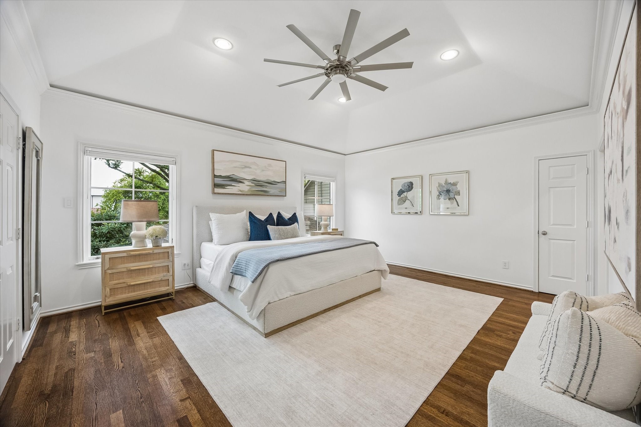 The Primary Bedroom is oversized and offers high ceilings, hardwoods, 3 closets & an all-new spa bath.