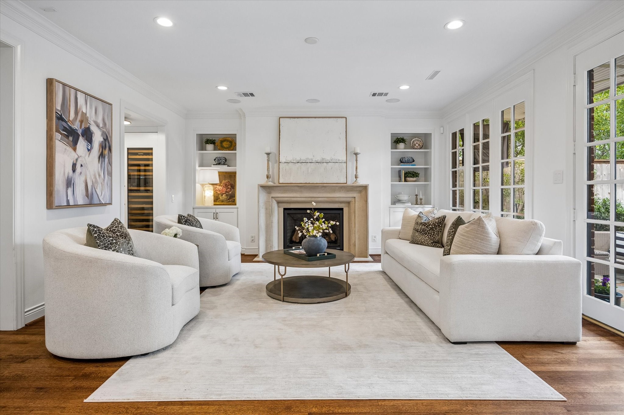 This gorgeous Den is beautifully appointed with a recent stone fireplace, custom built-ins and windows overlooking the patio & garden.