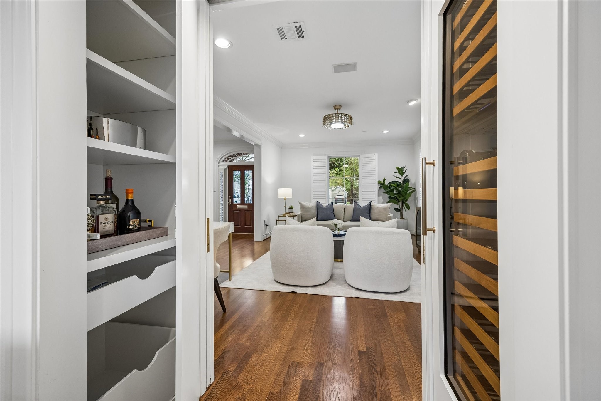 The owners added thoughtful wine storage and "hidden" dry bar in this space off the Living Room and Den.