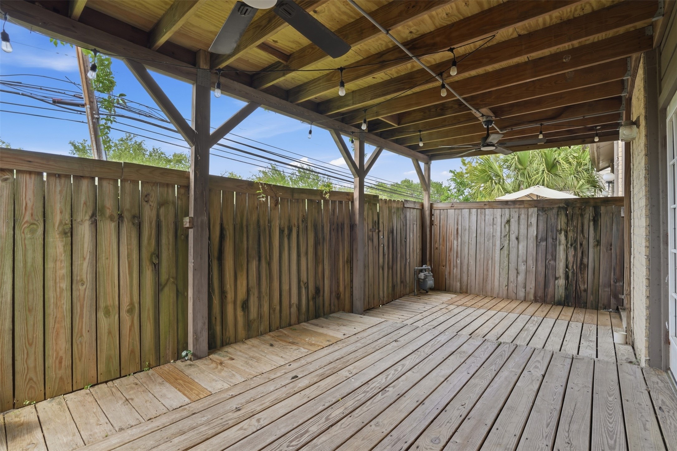 Covered private deck located just off the living and dining areas, perfect for indoor outdoor living, relaxing, or entertaining guests.