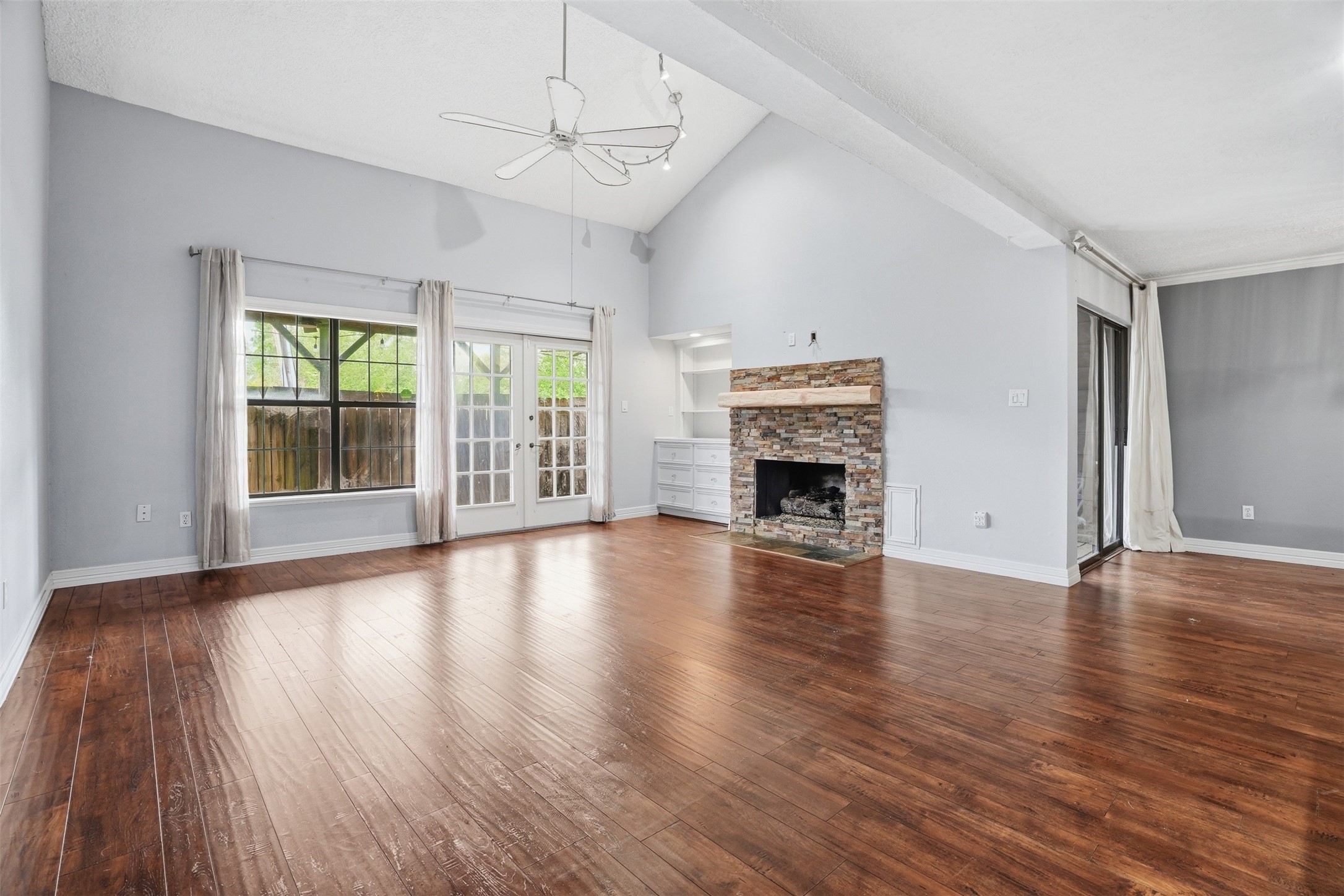Inviting living room centered around a beautiful stone fireplace that adds warmth, character, and timeless appeal. Inviting living room centered around a beautiful stone fireplace that adds warmth, character, and timeless appeal.