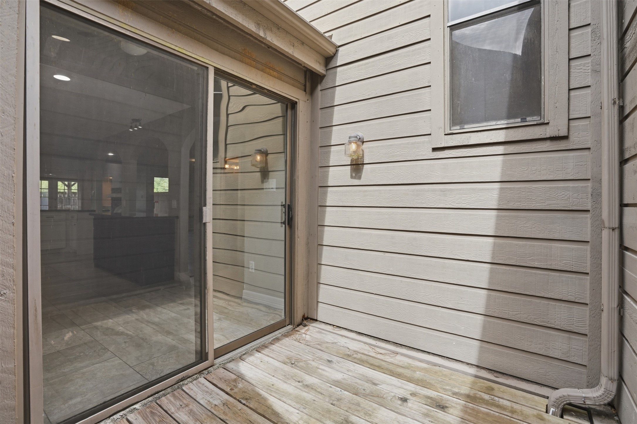Private outdoor deck located just off the kitchen and breakfast nook area, offering the perfect space for fresh air, grilling, or easy indoor outdoor living.