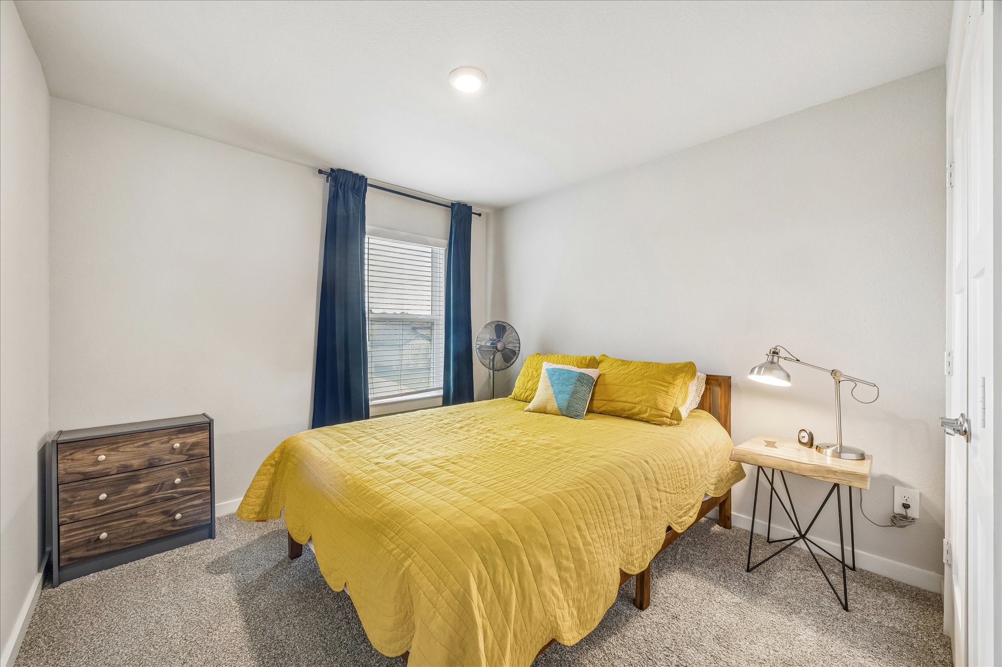 One of the upstairs secondary bedrooms. All of the rooms are spacious and offer amazing natural light.