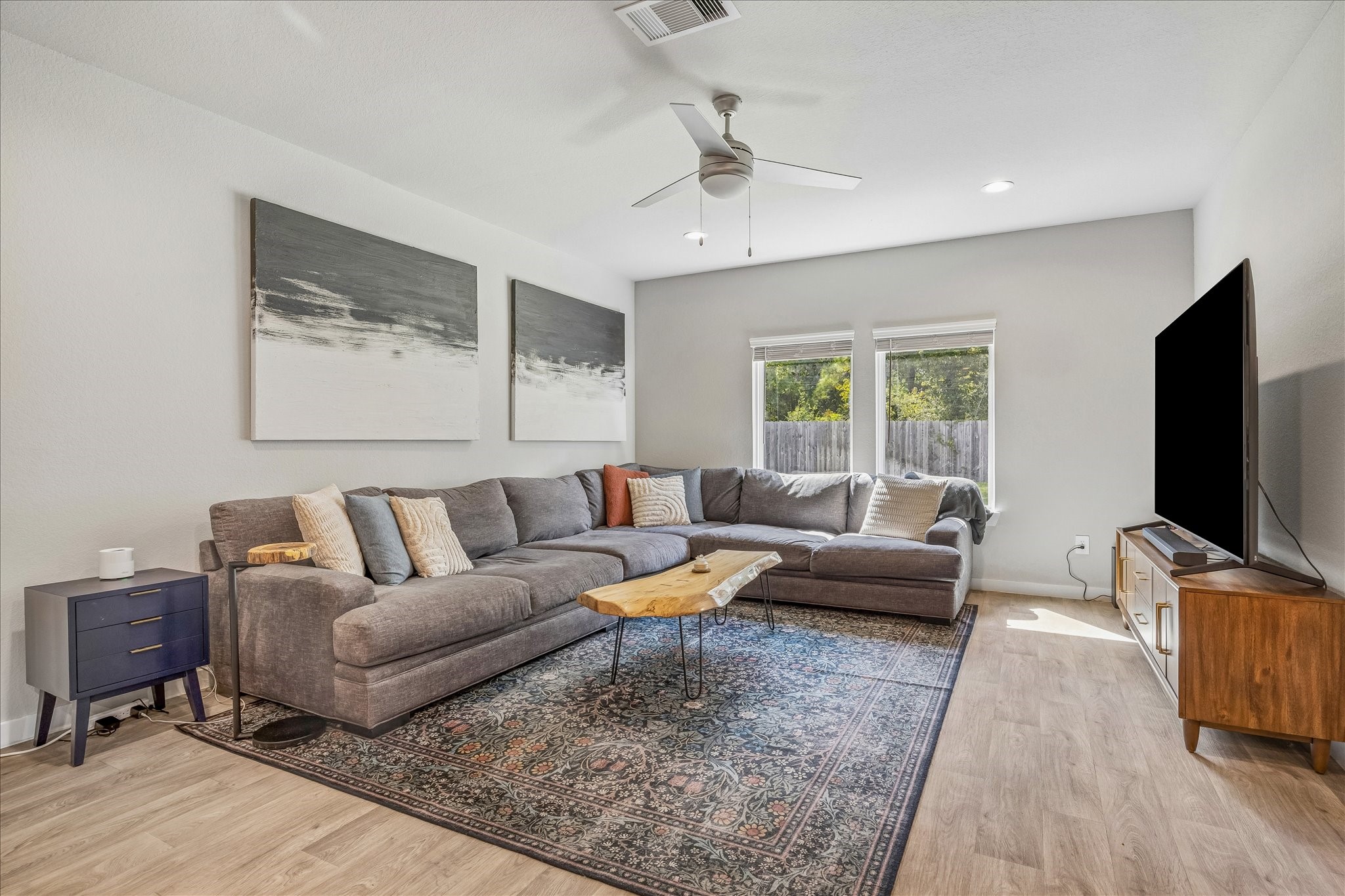 The family room is open and bright. Wonderful view of the backyard and those beautiful trees!