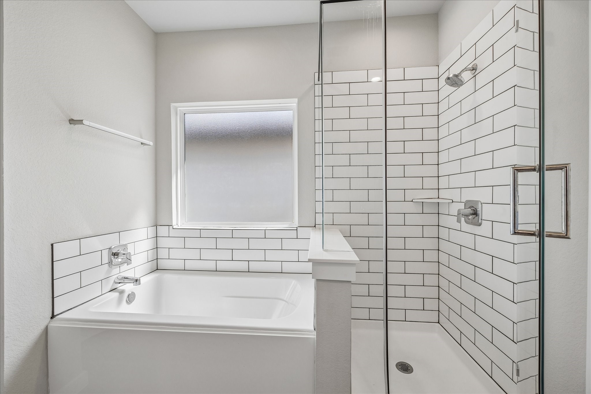 Large separate shower with frameless glass and separate tub!