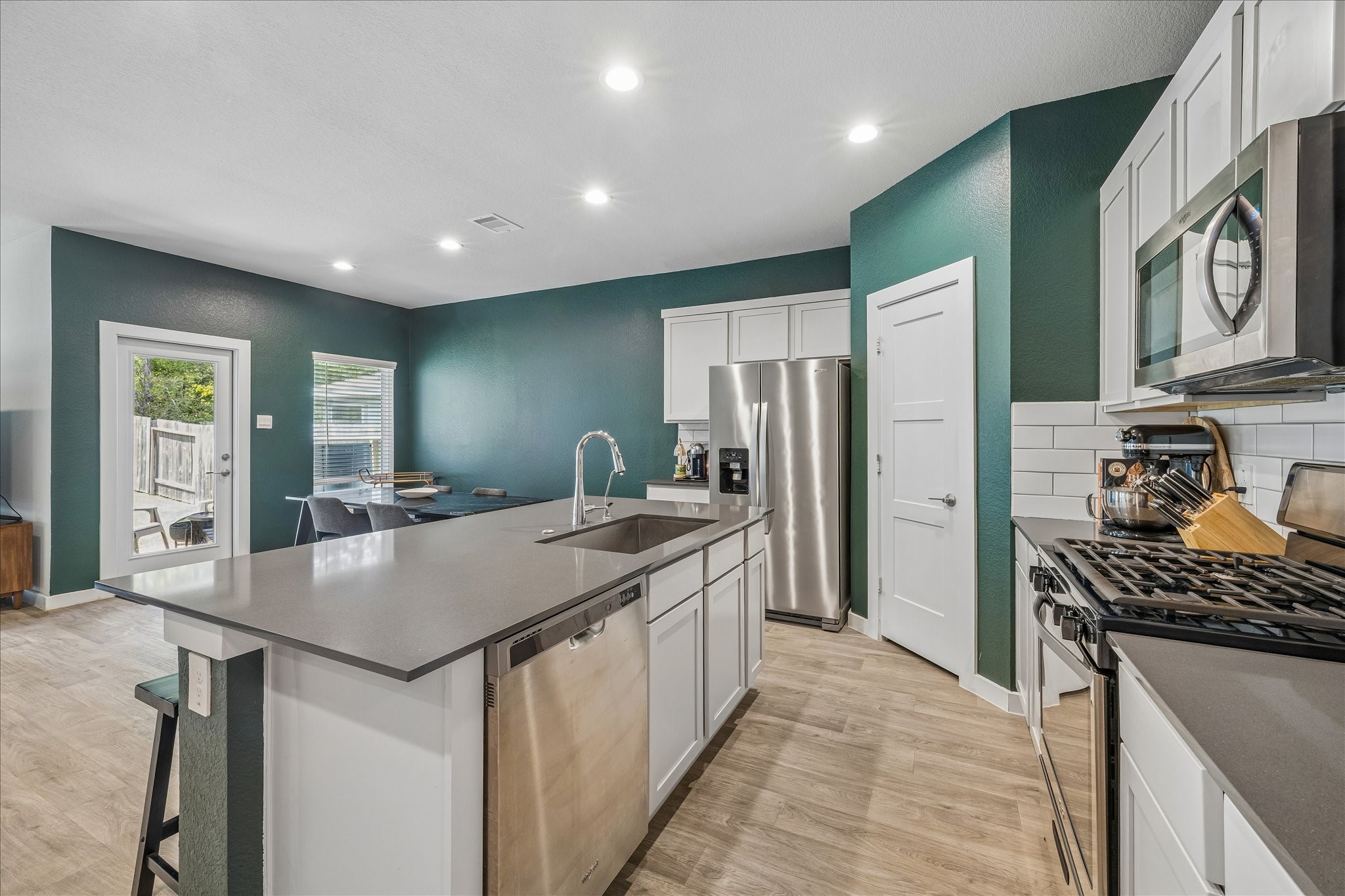 Gas range makes cooking all the more enjoyable! Large space for dining and breakfast counter for casual eating.
