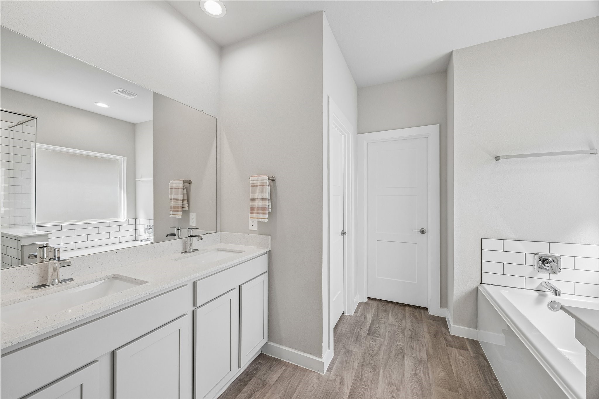 Move in ready! Make this your personal retreat. Solid surface counters, designer tile tub surround, vinyl plank flooring.