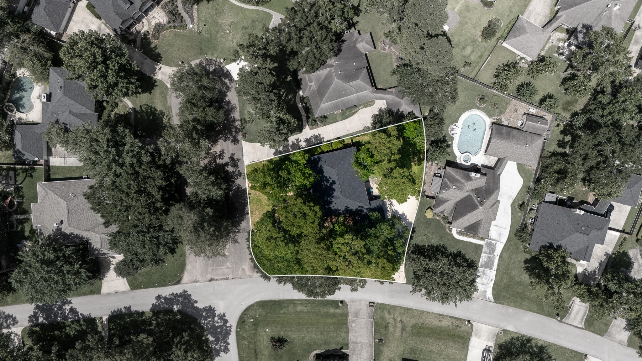 Nestled in a serene neighborhood, this property boasts ample tree coverage for privacy and a spacious lot perfect for outdoor living.