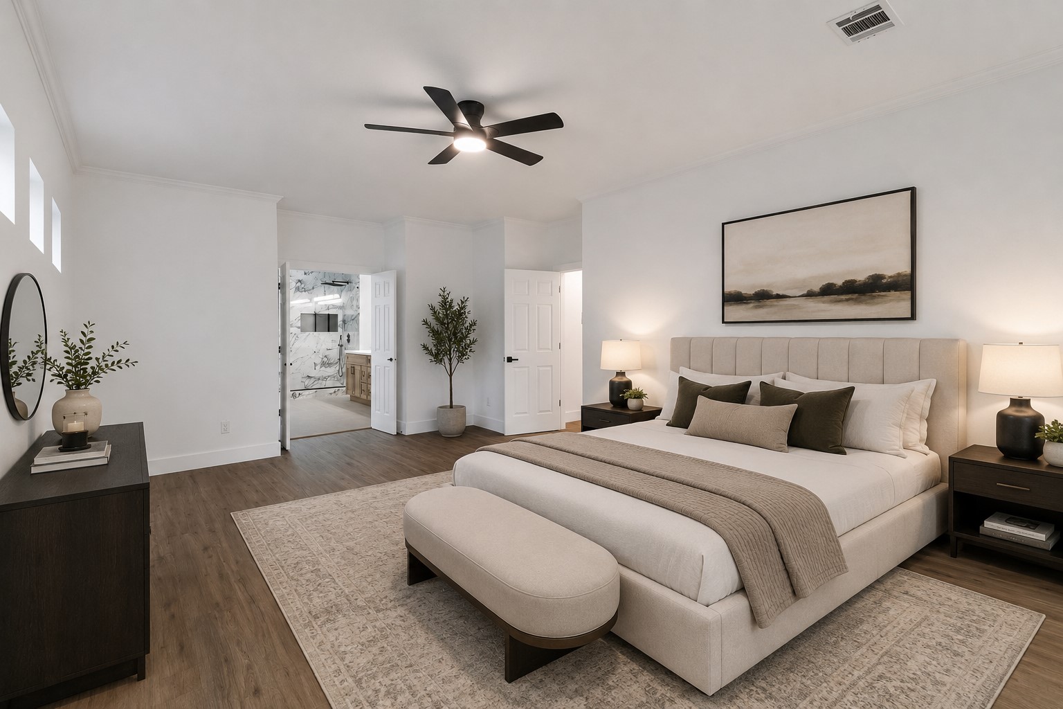 Spacious and elegant bedroom featuring a cozy bed, modern ceiling fan. Natural light streams through high windows, and an en-suite bath offers added luxury. Photo digitally staged.