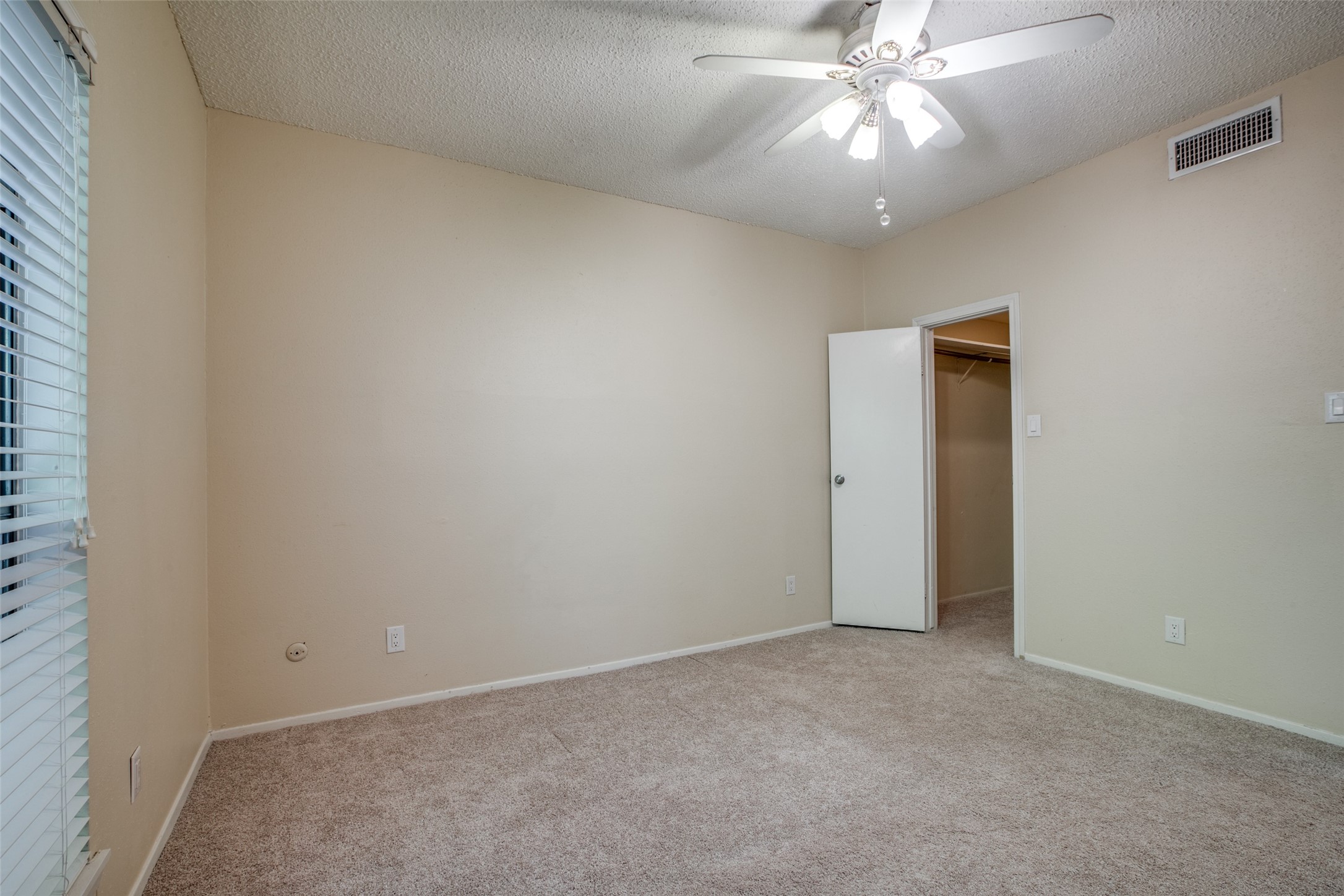 Ceiling fan in bedroom- looking toward closet