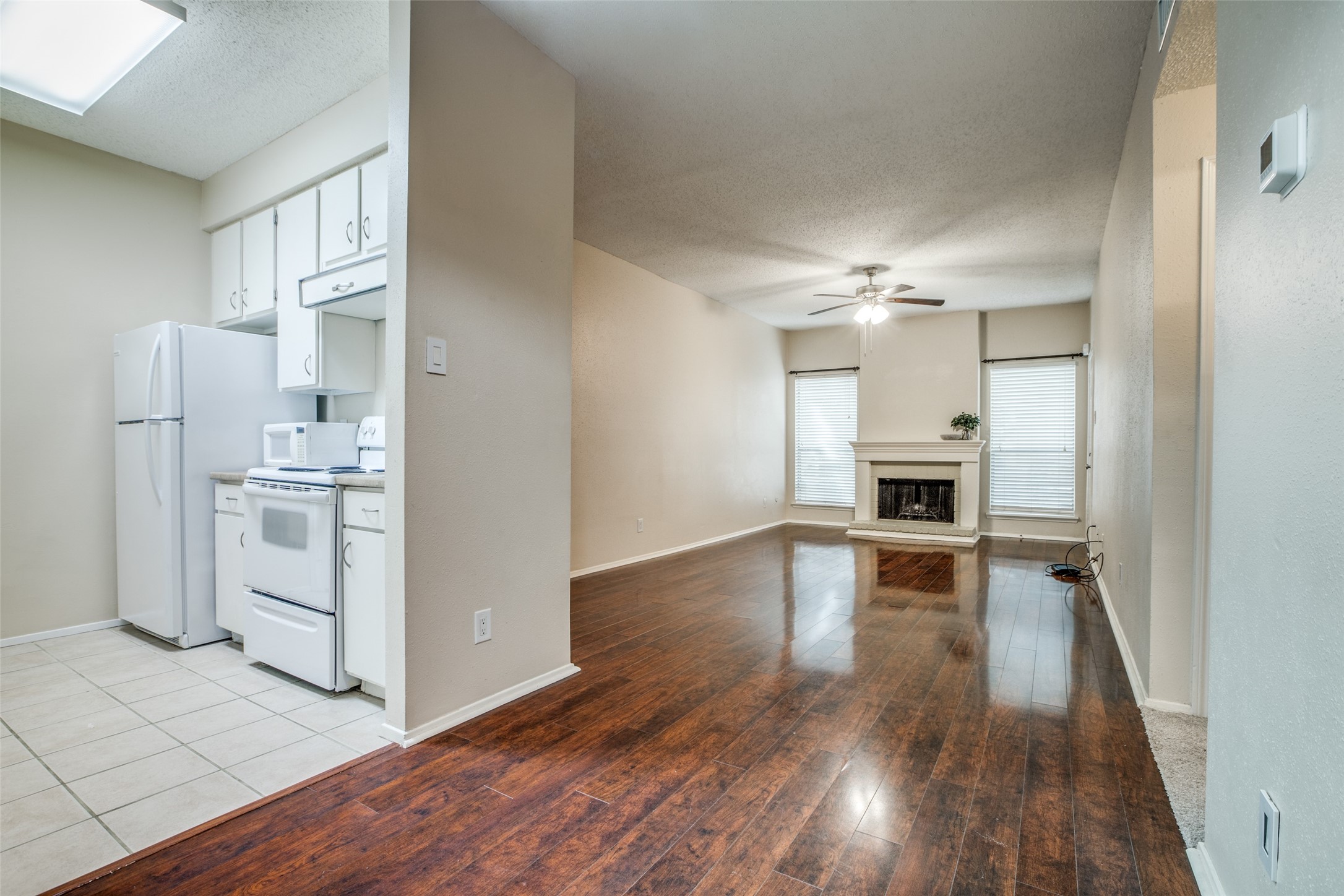 White kitchen featuring tile floor White kitchen featuring tile floor