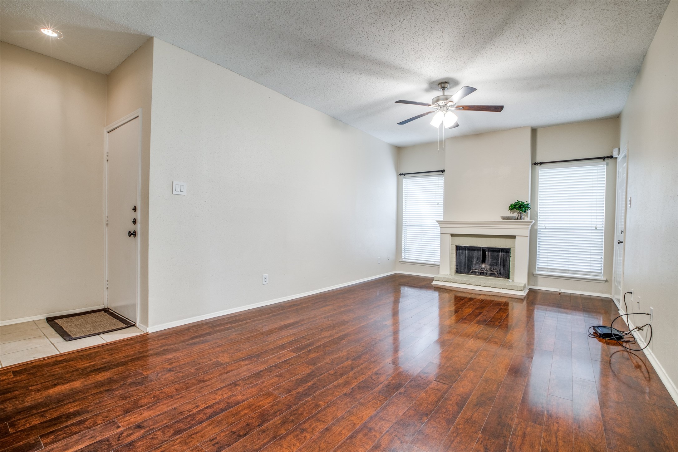 Entry way into first floor condo. Plenty of natural light thanks to the large windows