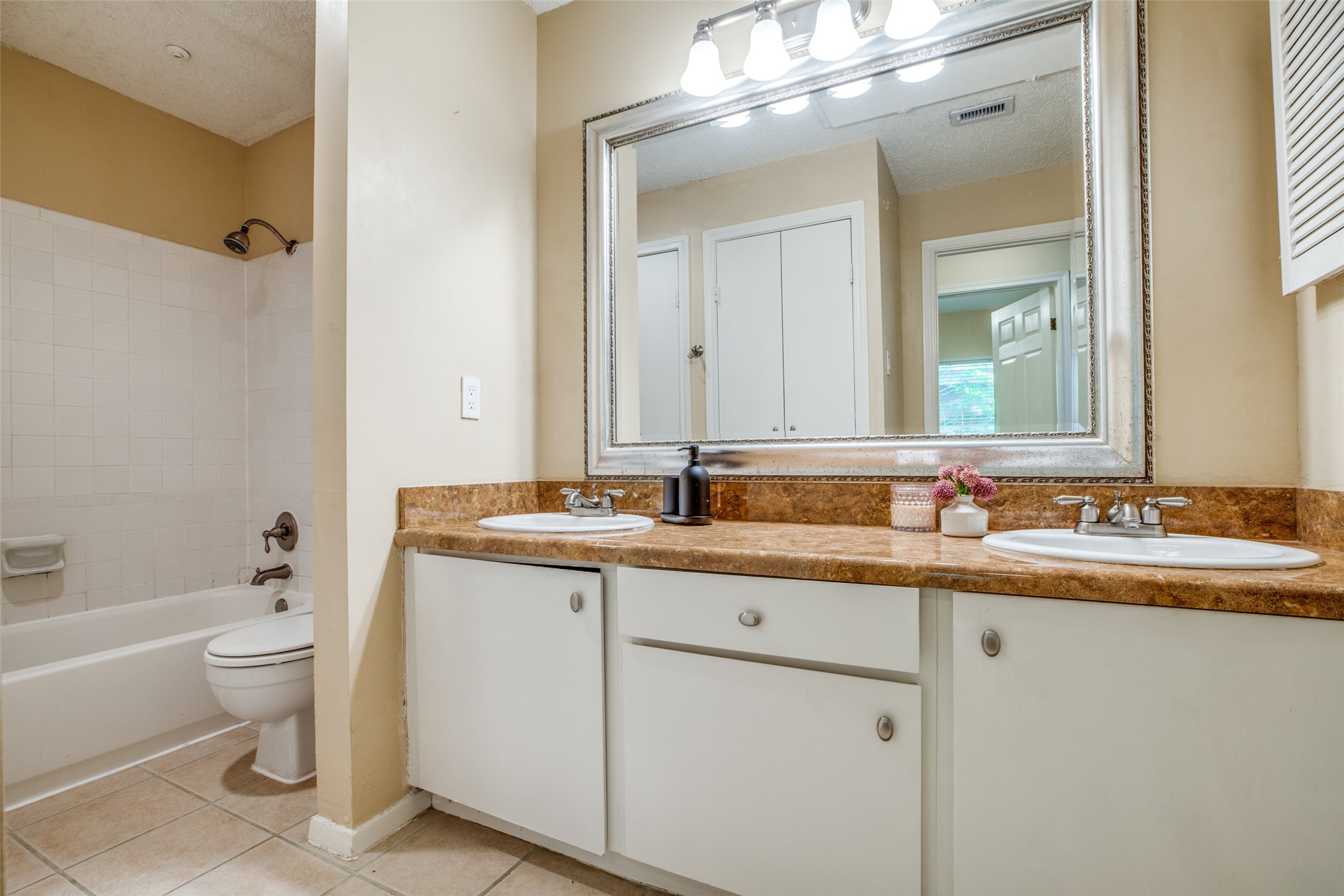 Bath-tub/shower combo and DOUBLE Vanity with updated counter tops