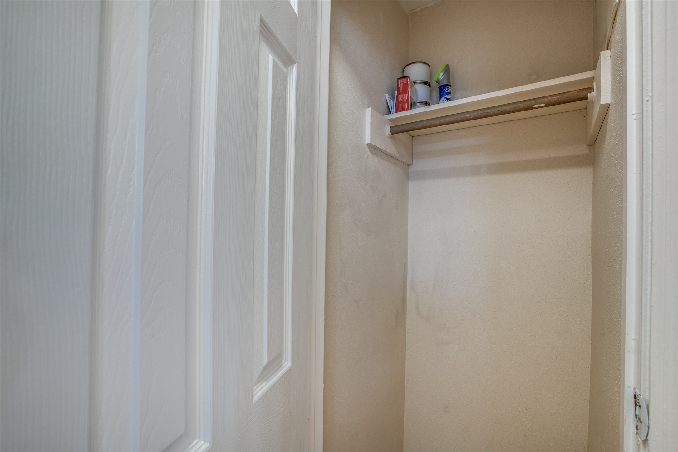 Hall closet with additional hanging space