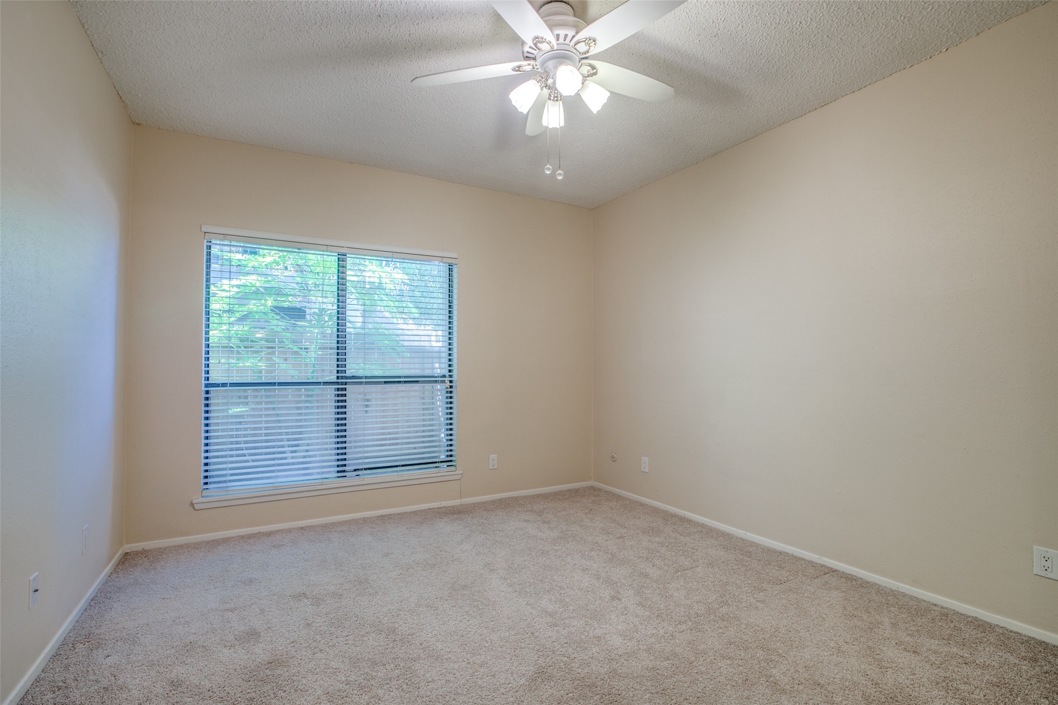 Entering the spacious bedroom with large window out to private patio. Entering the spacious bedroom with large window out to private patio.