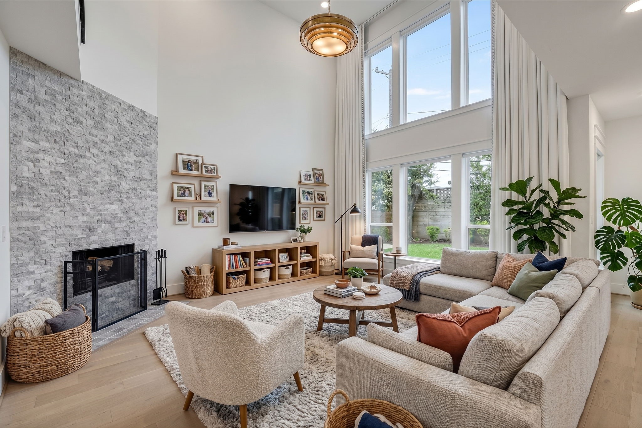 Soaring proportions and tall windows give the living room its scale.