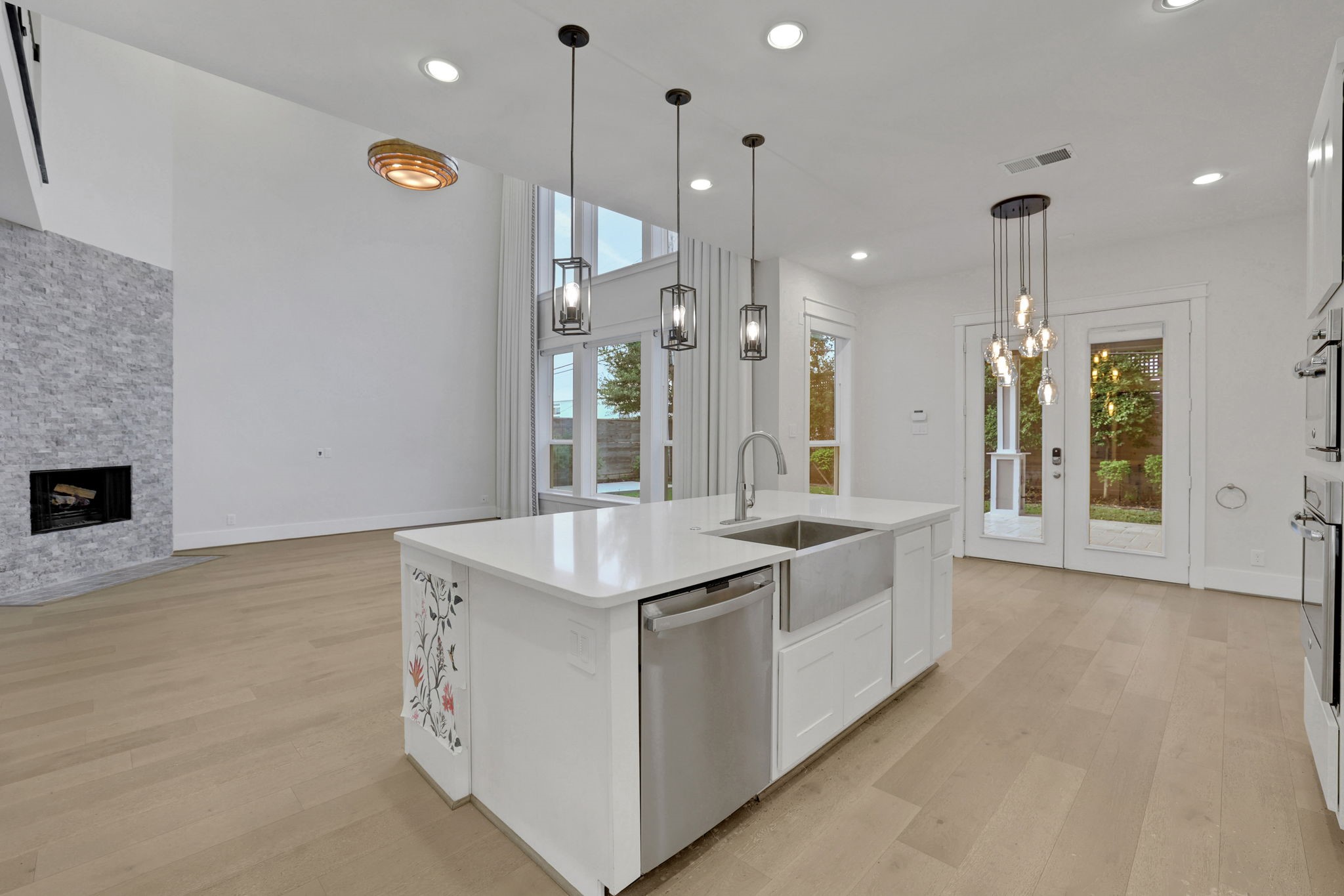 The island layout connects cooking, conversation and the living area.