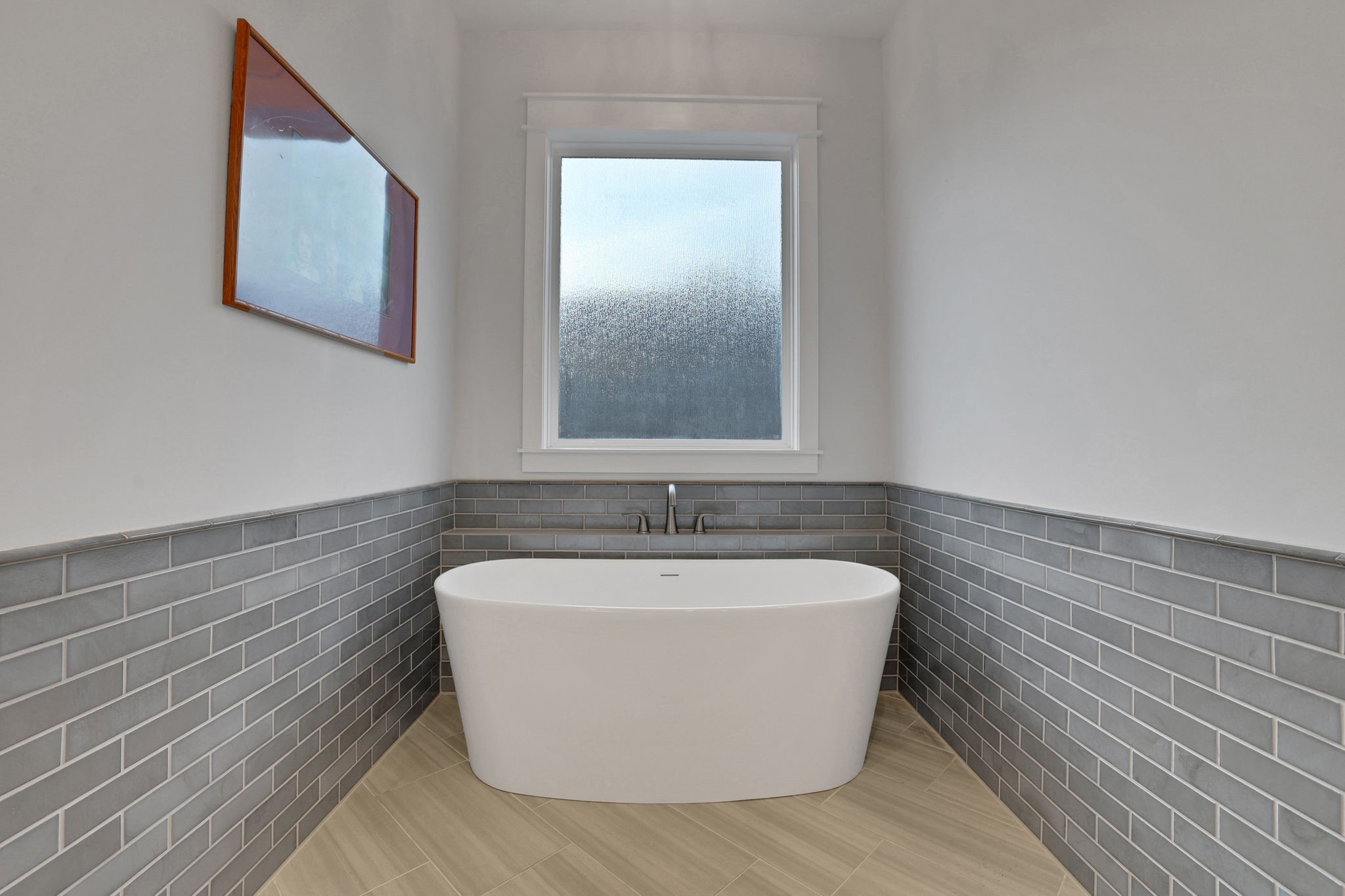 Tile and natural light give the bathing area a calm feel.