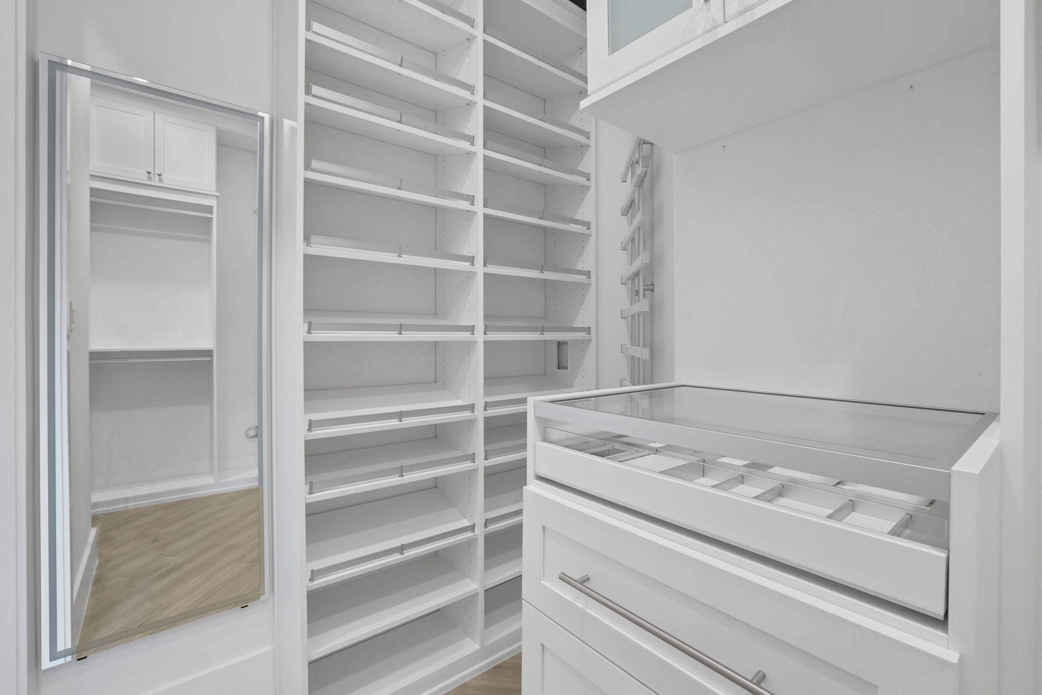 Built in shelving creates space for an organized wardrobe.