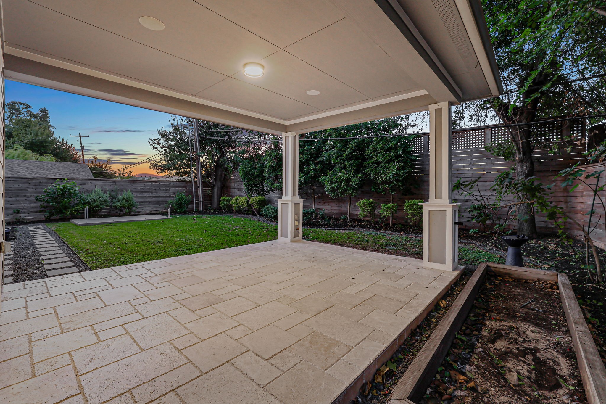A covered patio extends the living space outdoors.