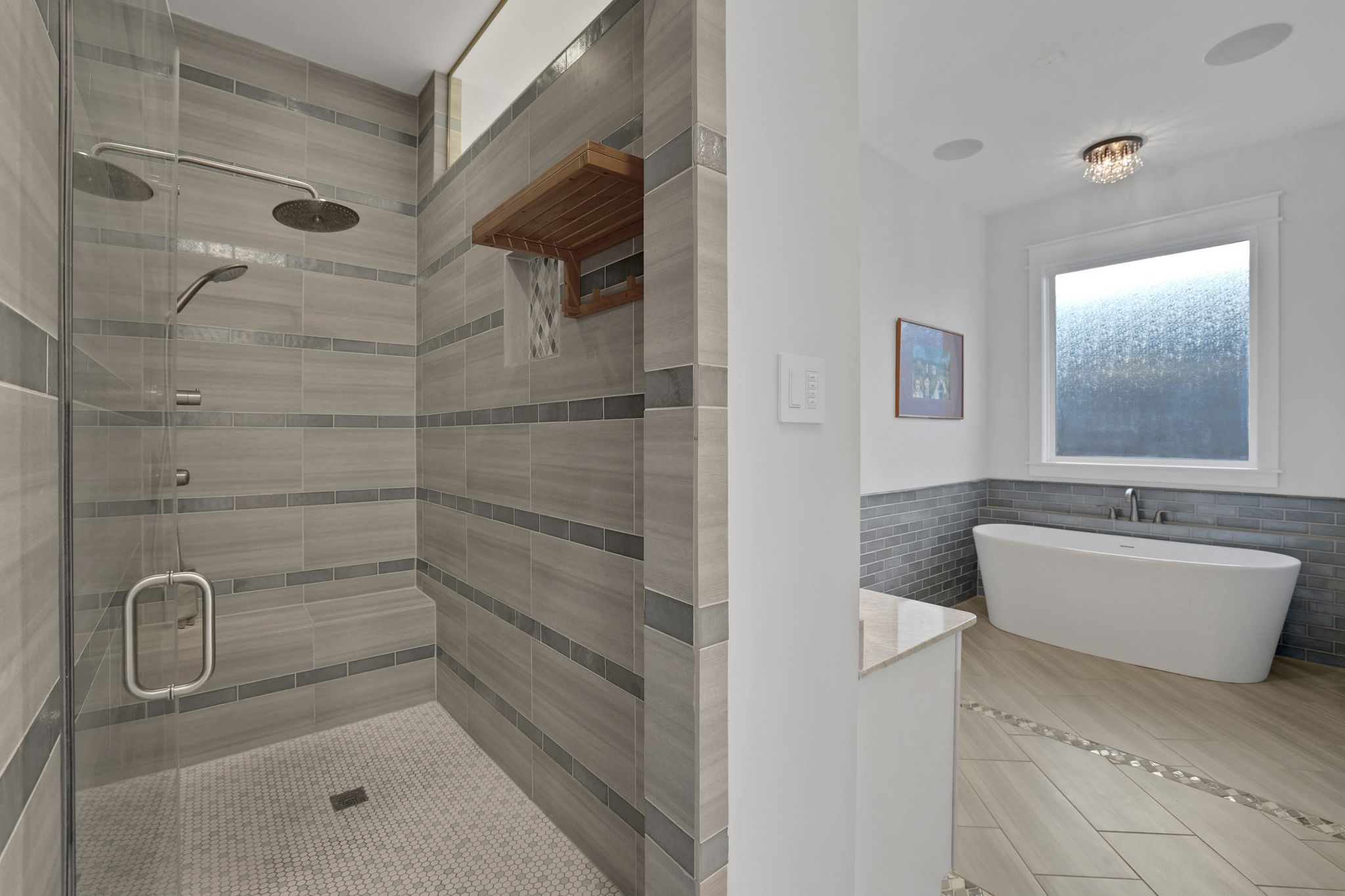 Glass shower panels keep the bath feeling open.