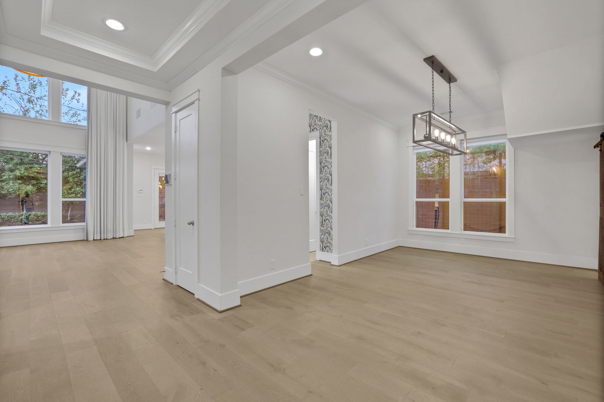 Wide windows and warm flooring keep this room bright.