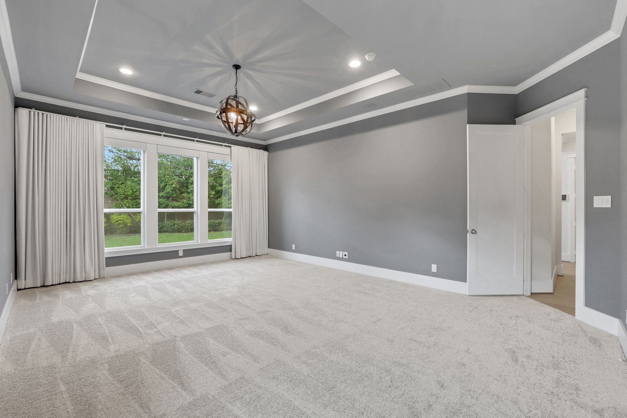 A detailed ceiling and french doors give this room presence.