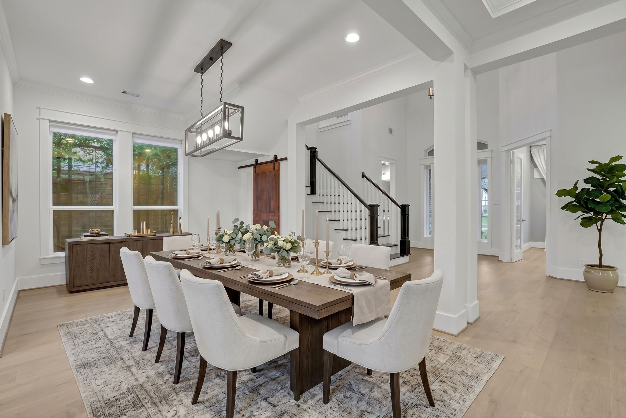 A chandelier and generous wall space set the scene for gathering.