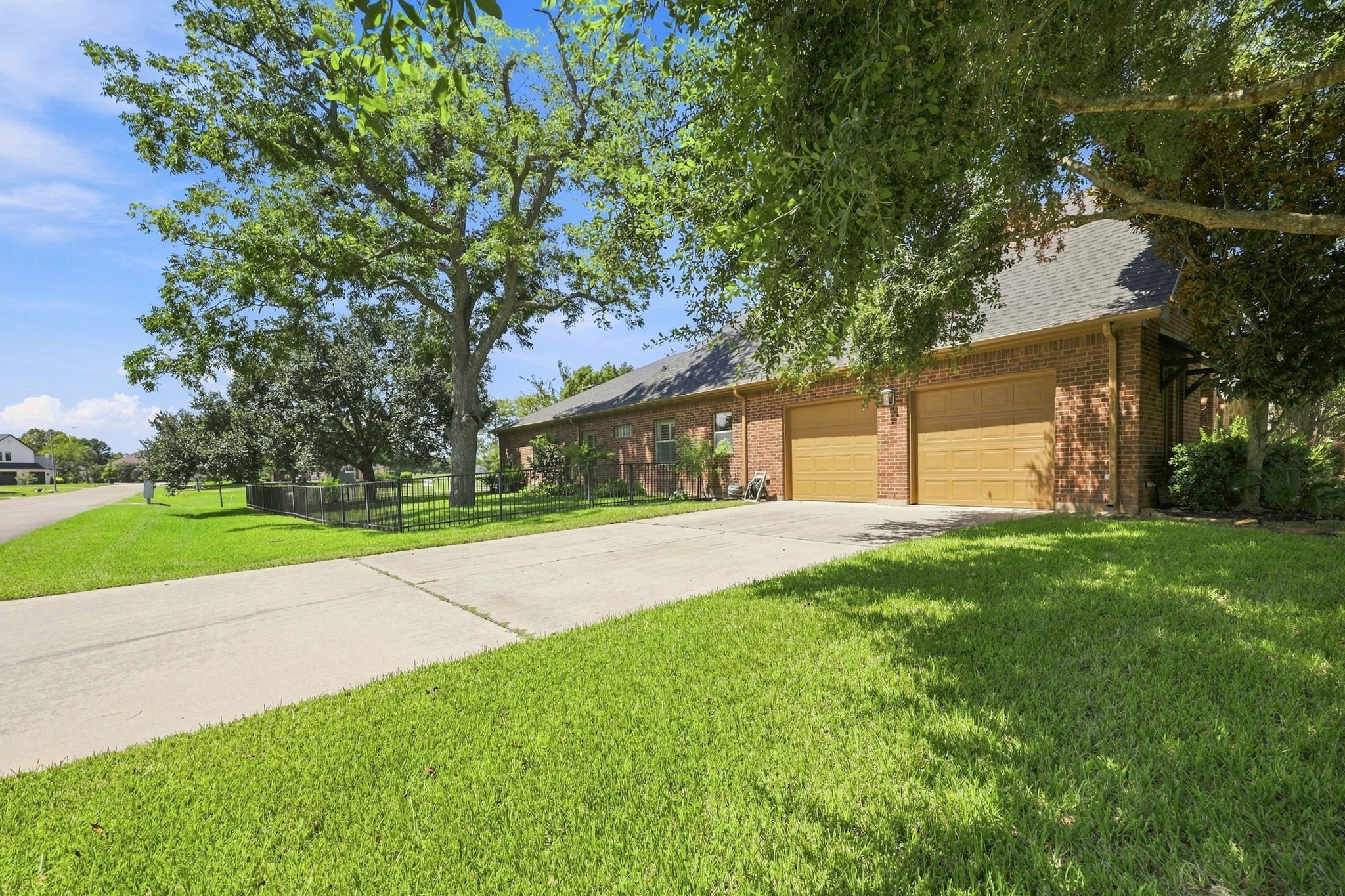 The property also features a separate garage entrance along the side of the home, providing additional parking and convenient access for family and guests. The generous driveway and side-entry configuration offer plenty of space for entertaining and everyday living. The property also features a separate garage entrance along the side of the home, providing additional parking and convenient access for family and guests. The generous driveway and side-entry configuration offer plenty of space for entertaining and everyday living.