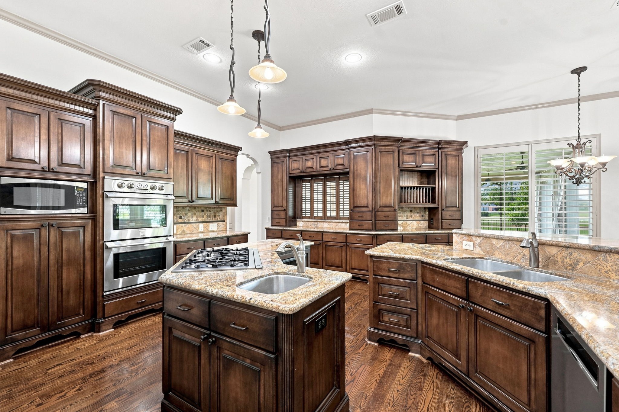 The Kitchen is equipped with a premium stainless steel appliance package, including Kenmore Pro double convection ovens, Refrigerator, a five-burner gas cooktop, and a KitchenAid dishwasher. This impressive combination provides the performance and versatility needed for everything from everyday meals to elaborate entertaining. Please note, the refrigerator icemaker does not work.
