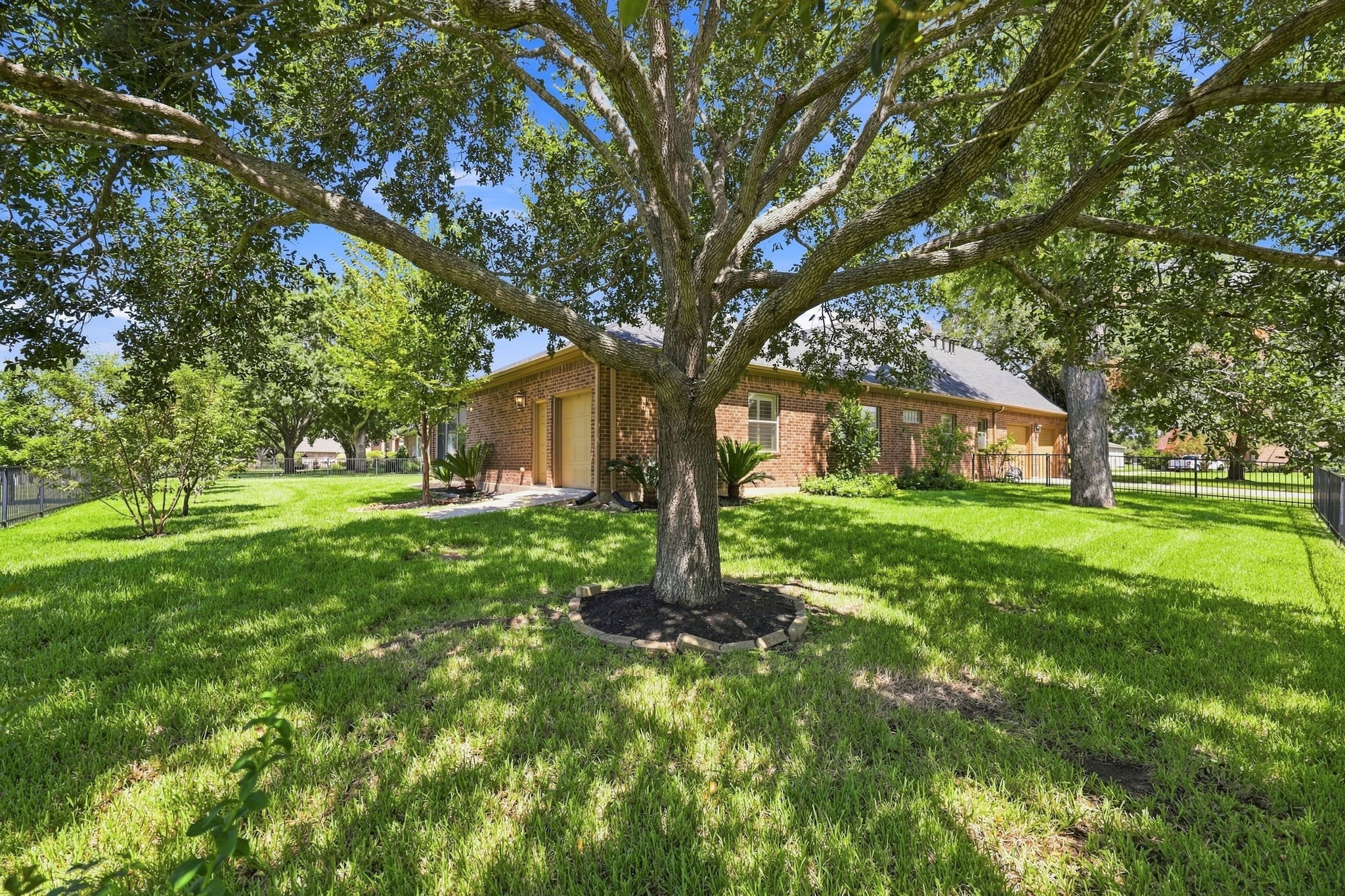Along with the oversized two-car garage, the property offers additional outdoor storage space along the side of the home. This convenient space is perfect for storing lawn equipment, a golf cart, bicycles, tools, and other outdoor essentials, keeping everything organized and easily accessible measuring approximately 9 x 11.