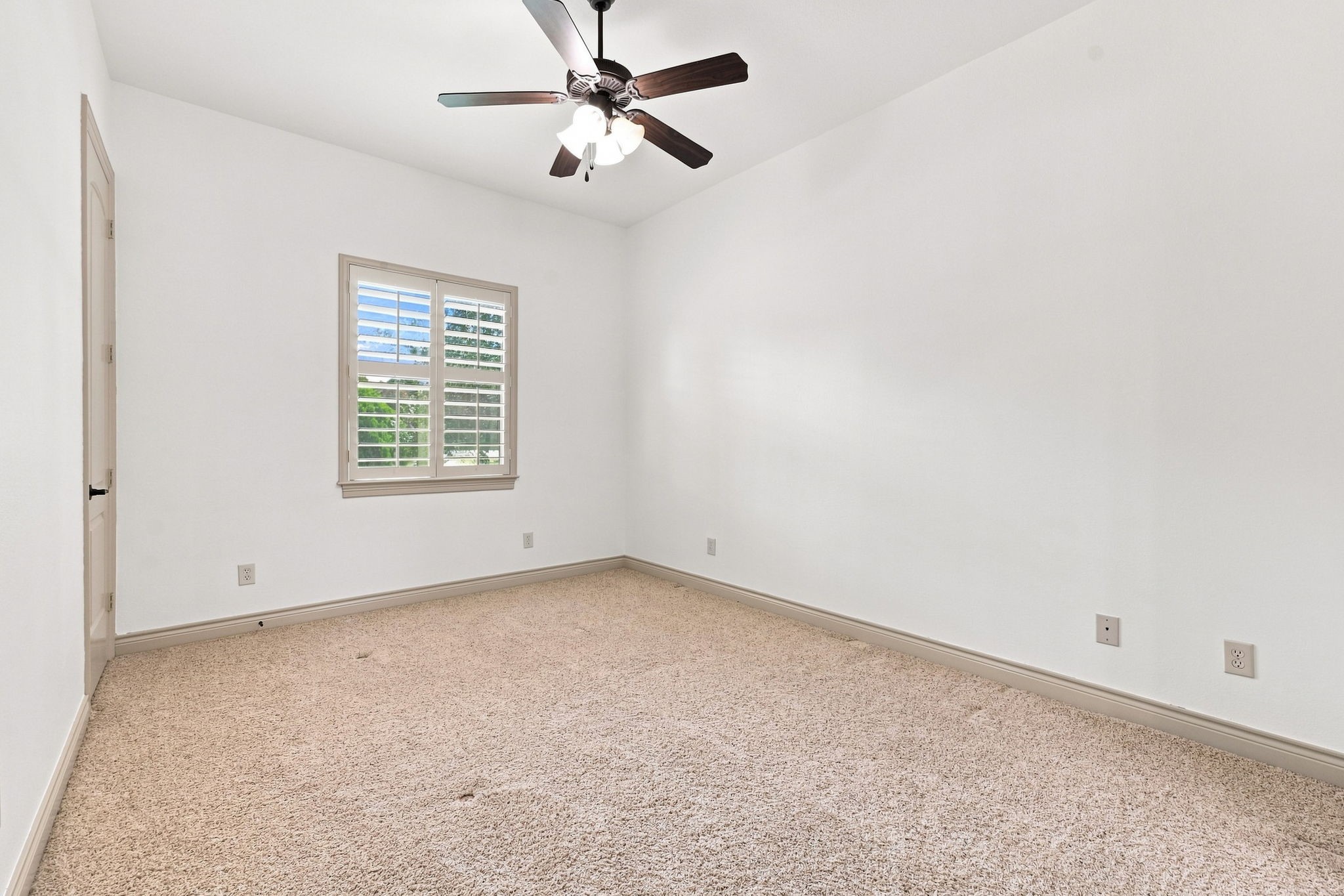 Another generously sized Secondary Bedroom features direct access to the Full Bathroom, shown in the previous photos. The thoughtful layout provides added privacy and convenience.