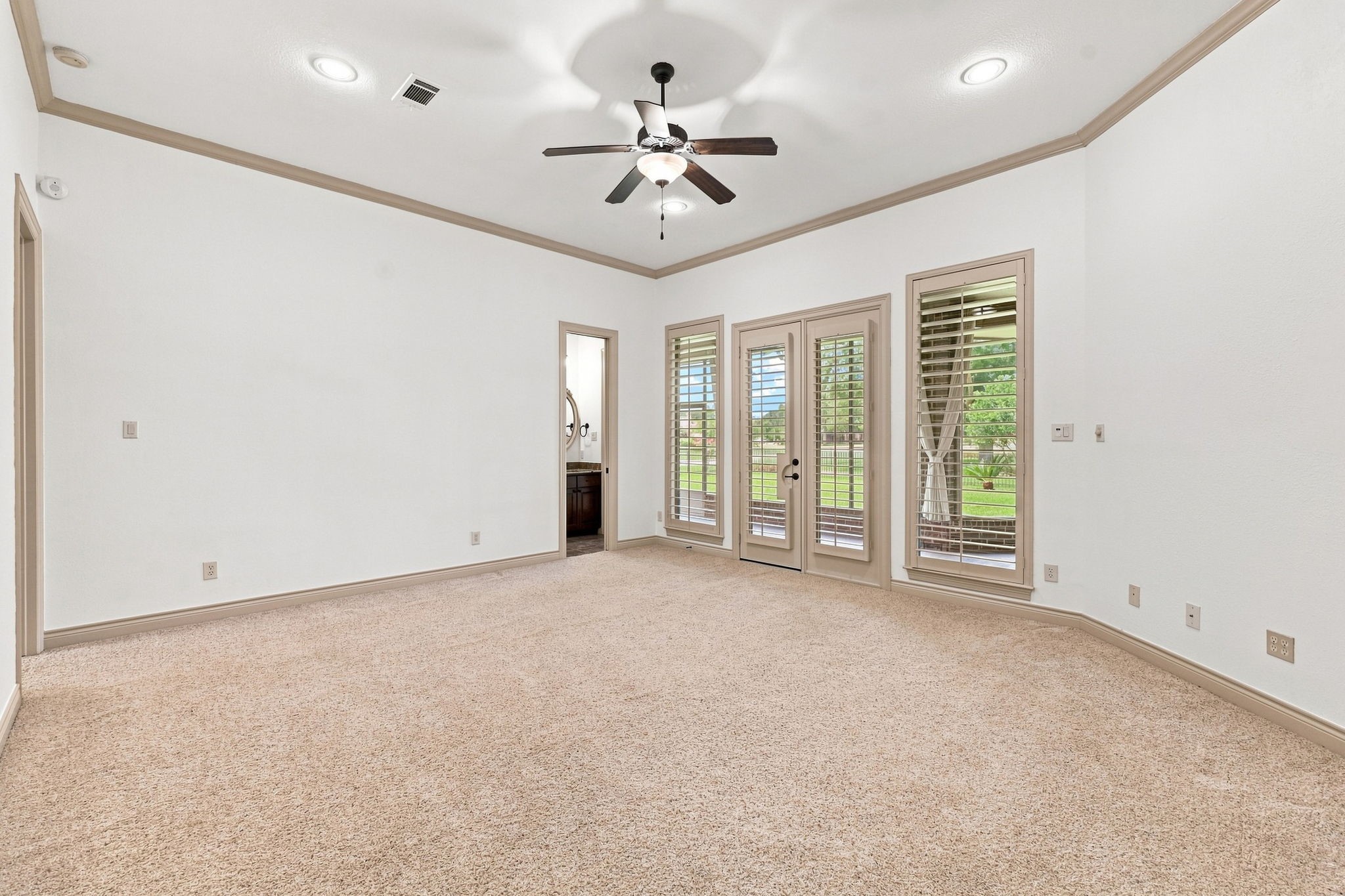 The spacious Game Room offers plenty of room for a large-screen TV and comfortable furnishings, making it an ideal space for movie nights, game days, and entertaining family and friends. Direct access to the screened-in back patio extends the living space outdoors, while a conveniently located Half Bath adds functionality for guests.
