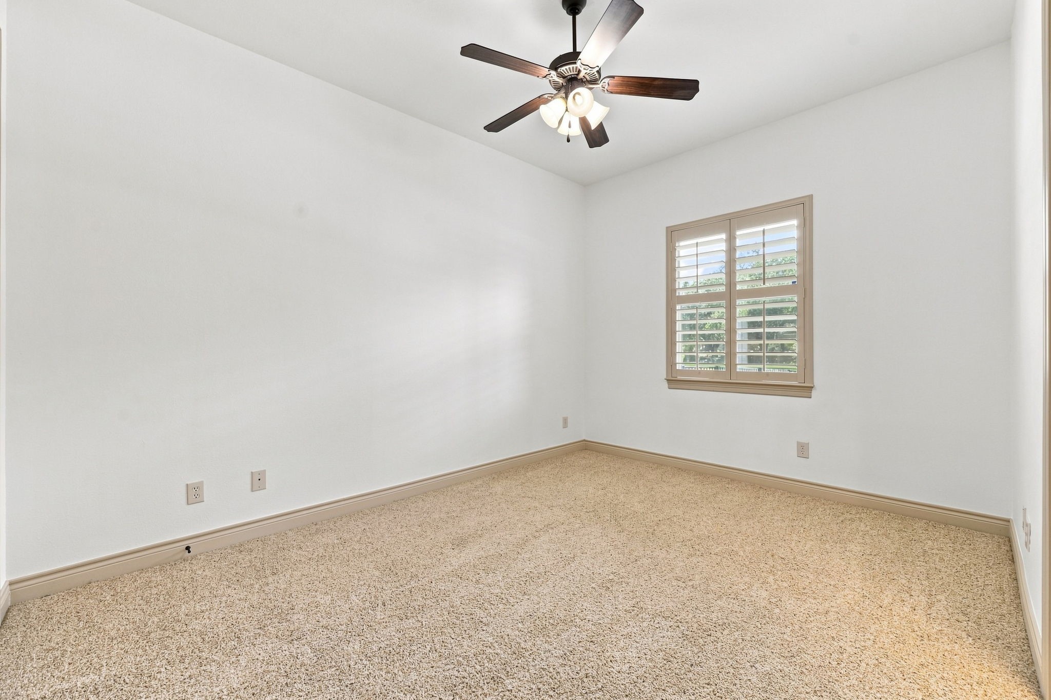 Another Secondary Bedroom with large window and walk-in closet.