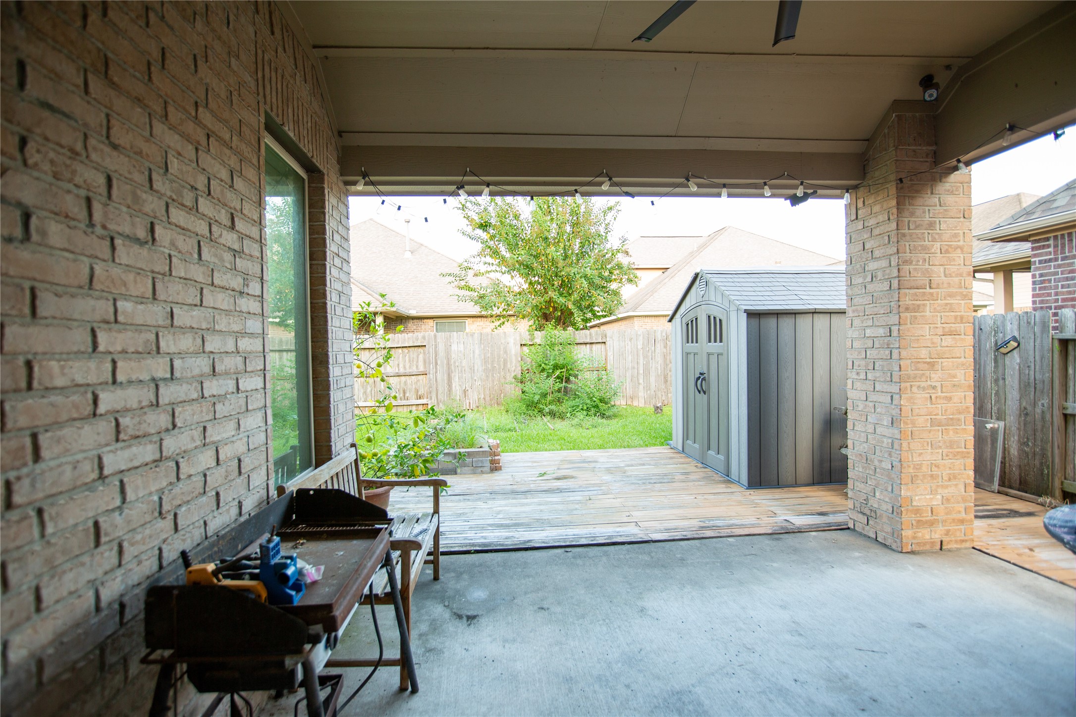 Covered patio with wood decking outside