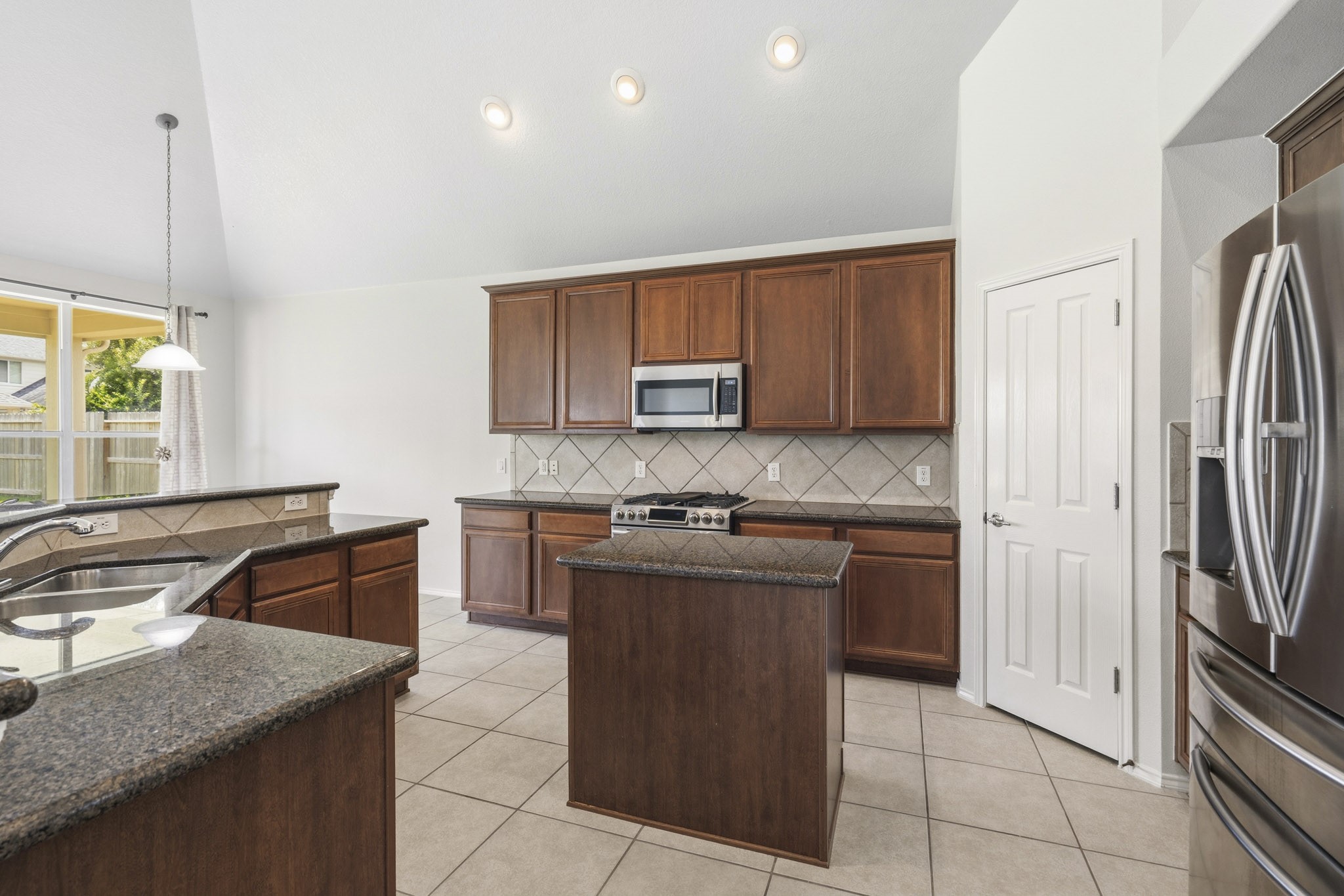 Dream kitchen with an open layout and wonderful views of the bright breakfast area, making meal preparation and gathering effortless.