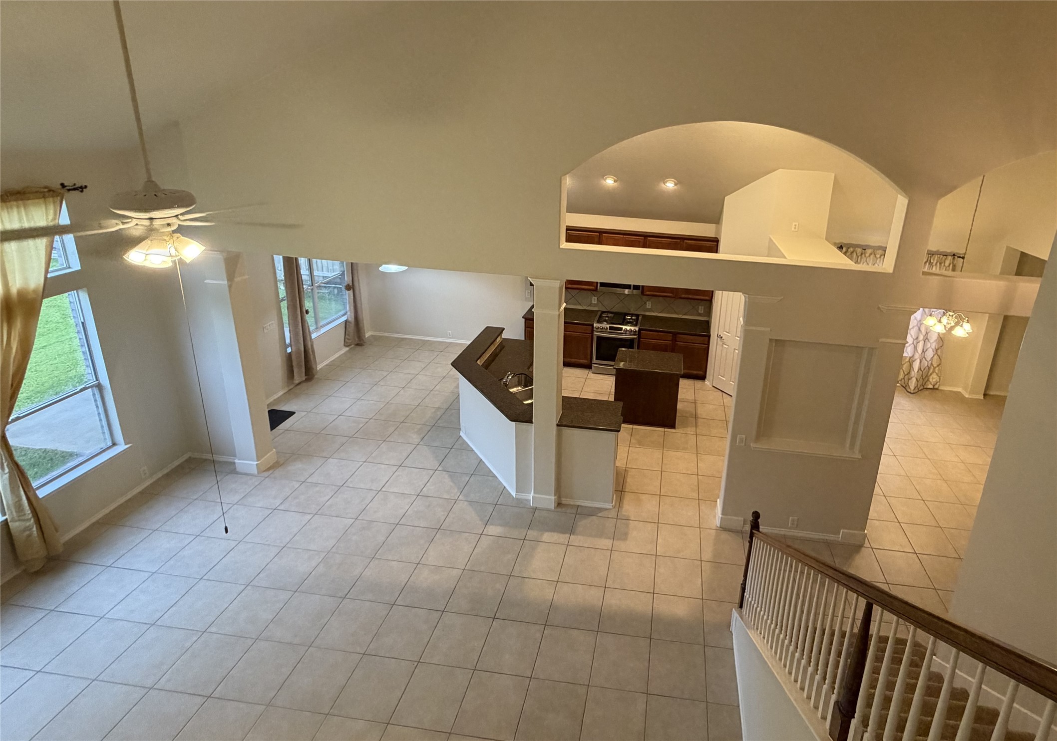 View of expansive living room, breakfast area, kitchen and formal dining and elegant architectural features