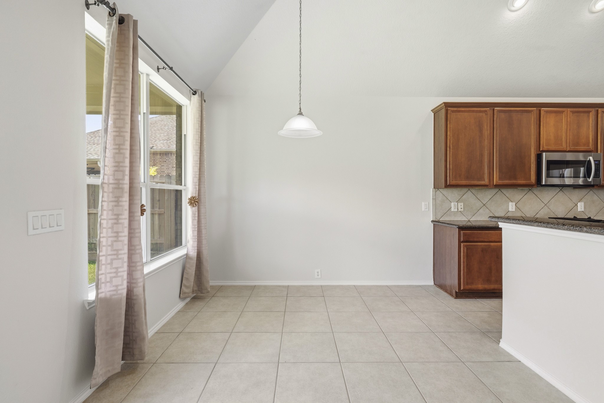 Bright and inviting breakfast area offering comfortable everyday dining with abundant natural light.