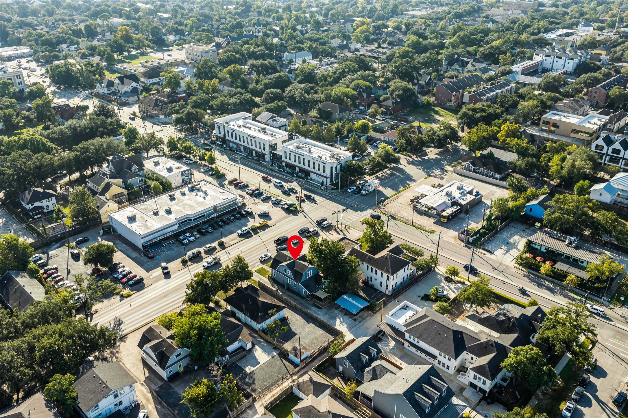 Overhead view showcasing the property's depth, parking configuration, and accessibility from the surrounding streets