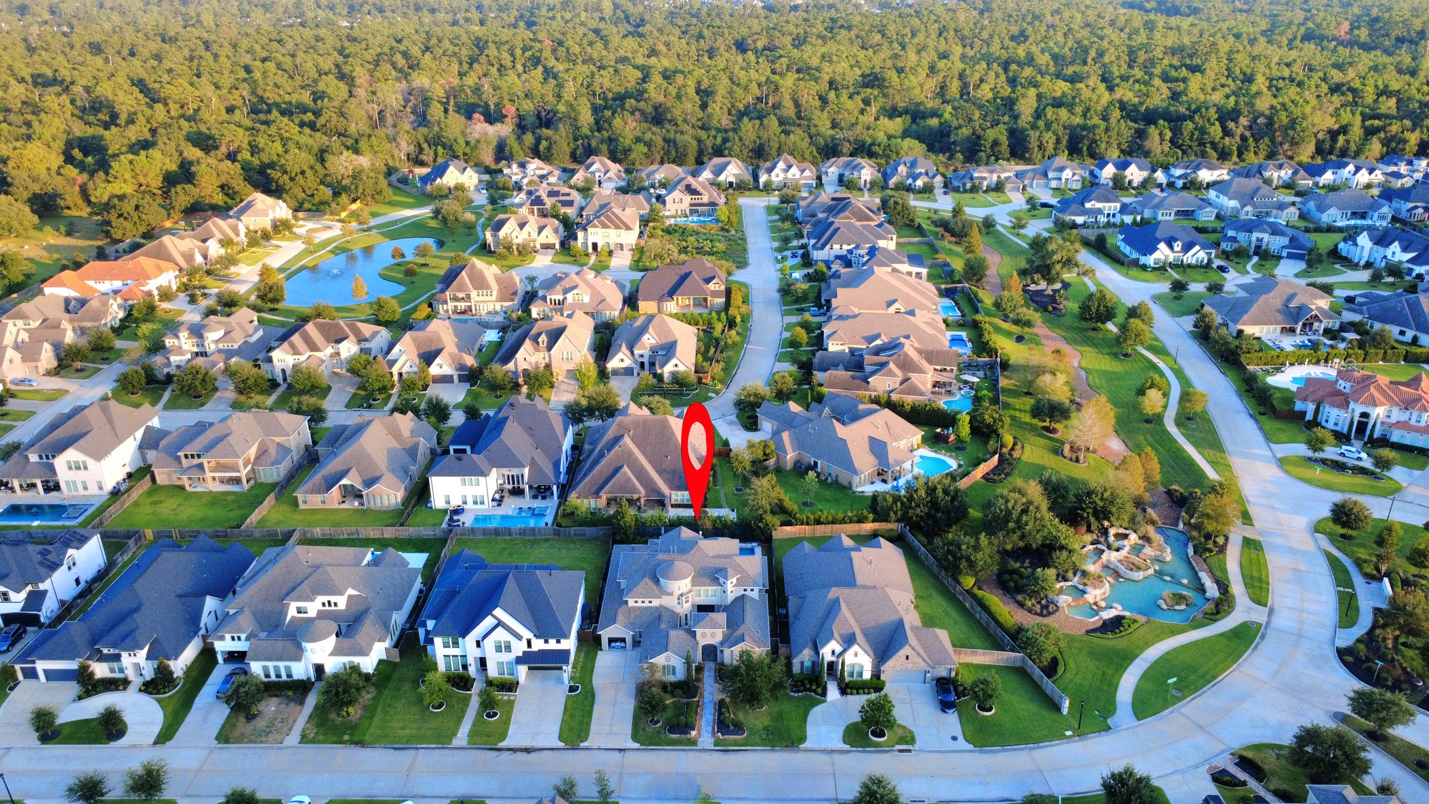 Experience luxury living in the prestigious gated community of Bridlecreek, featuring a scenic lake, beautiful waterfall entrance, and picturesque walking trails throughout the neighborhood.