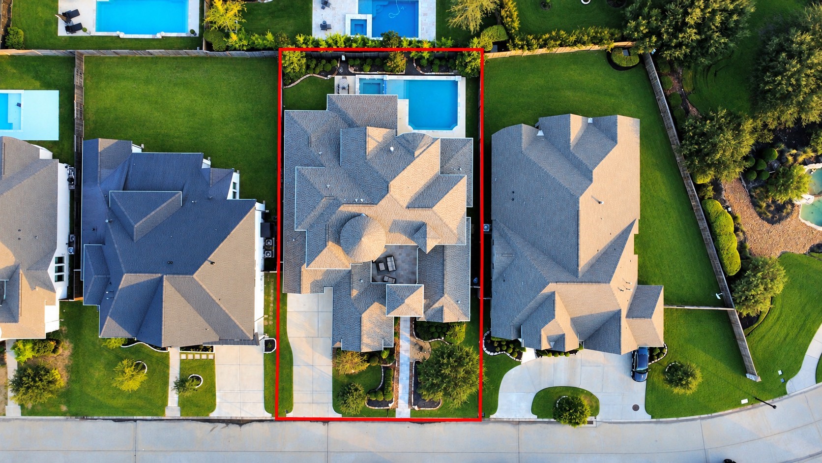 Aerial view of this stunning 5,142 sq. ft. home featuring 5 bedrooms, 4 full bathrooms, a split 3-car garage, and a 10,800 sq. ft. lot. Built in 2017, with a roof replaced in 2022 and a resort-style pool and spa added in 2022.