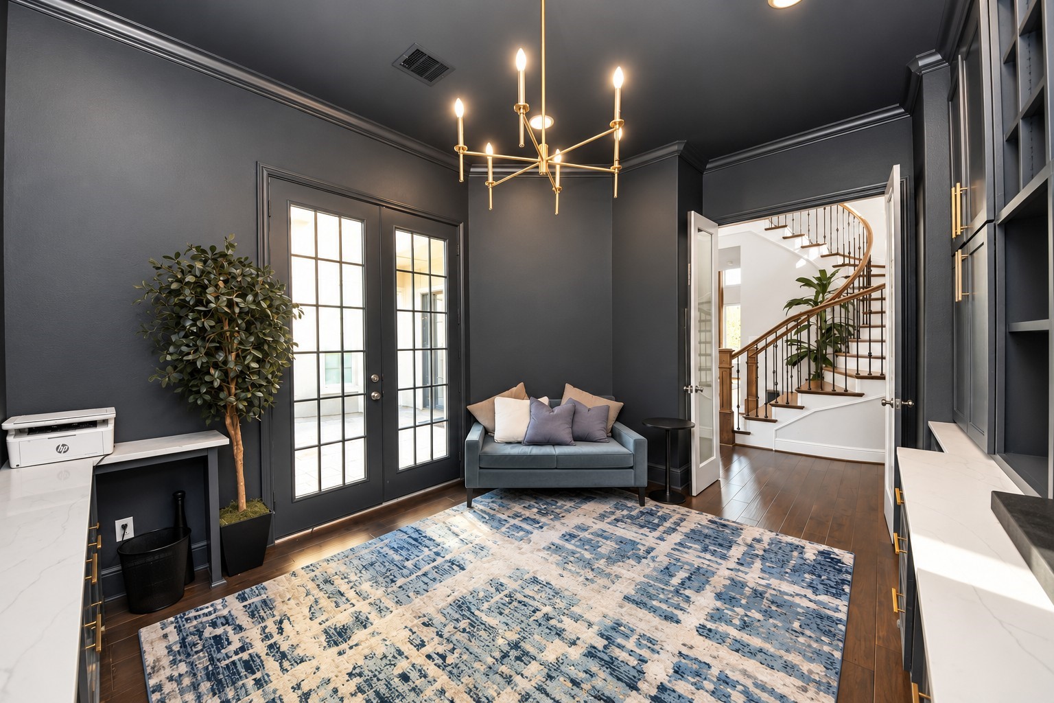 Another view of this impressive private study featuring double doors leading to the courtyard and convenient access to the grand foyer with its soaring ceilings and elegant staircase.