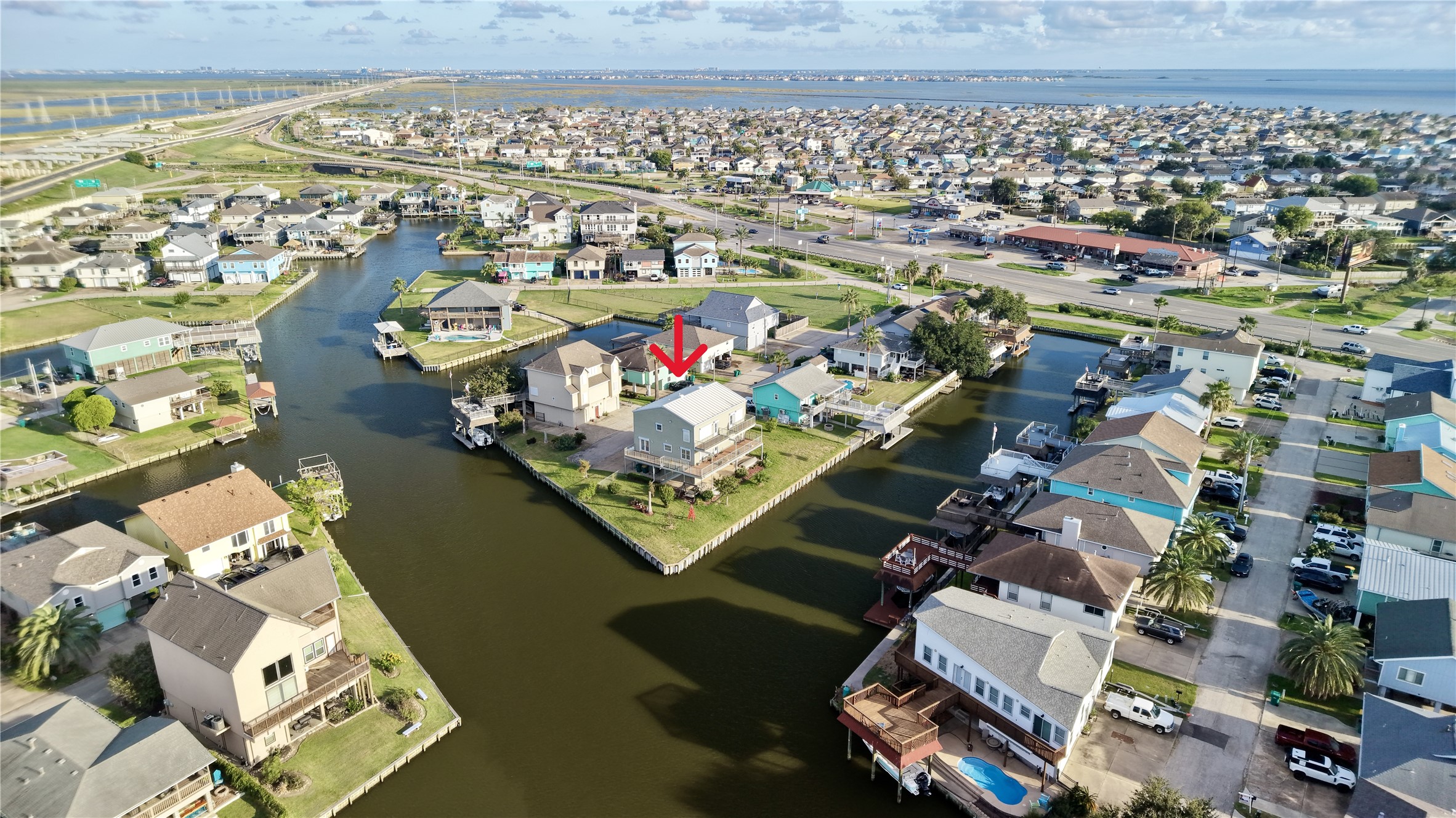 Aerial view of Omega Bay's canal community, with deep-water canals leading out to Galveston Bay. The Galveston Causeway, open bay views, and nearby shopping and dining along I-45 are all just minutes away.